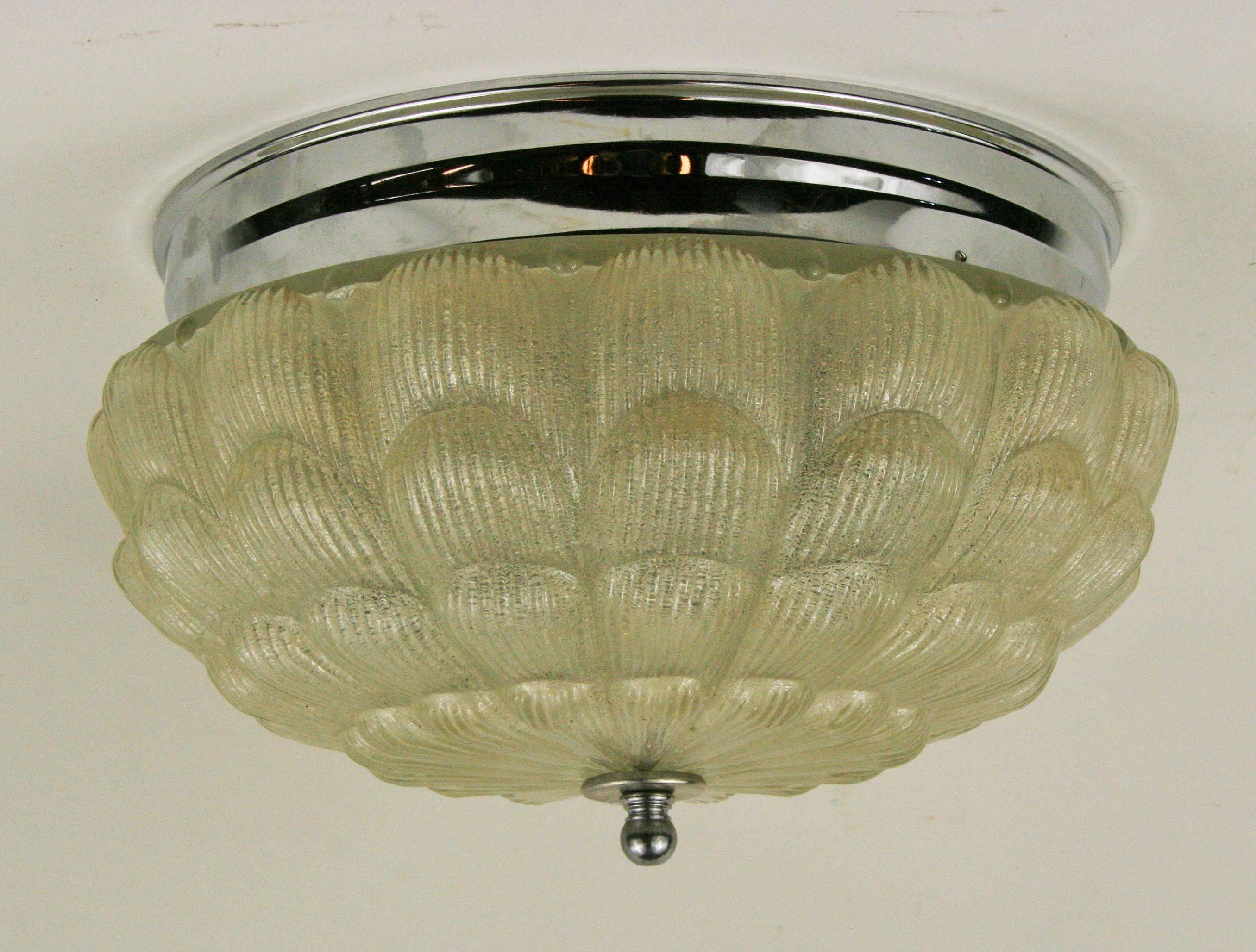 1-3030, Art Deco shell shaped flushmount.
Takes two 60 watt Edison based bulbs.
NO ADDITIONAL DISCOUNTS ON SALE ITEM