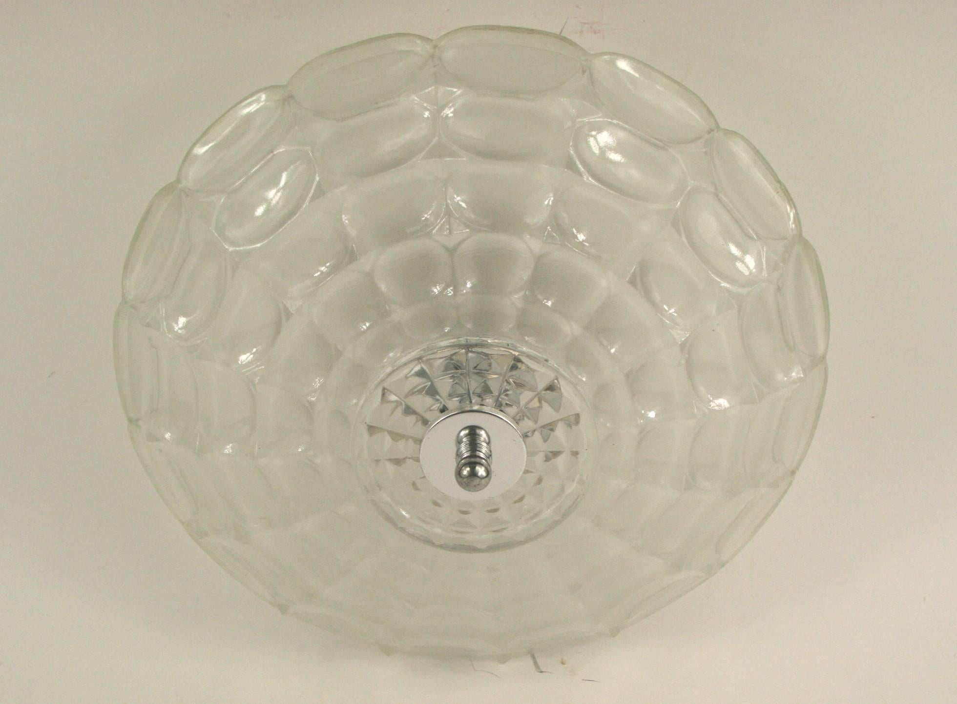 1-2912a   deco embossed glass flushmount.

Two internal lights 60 watt candelabra base.
 