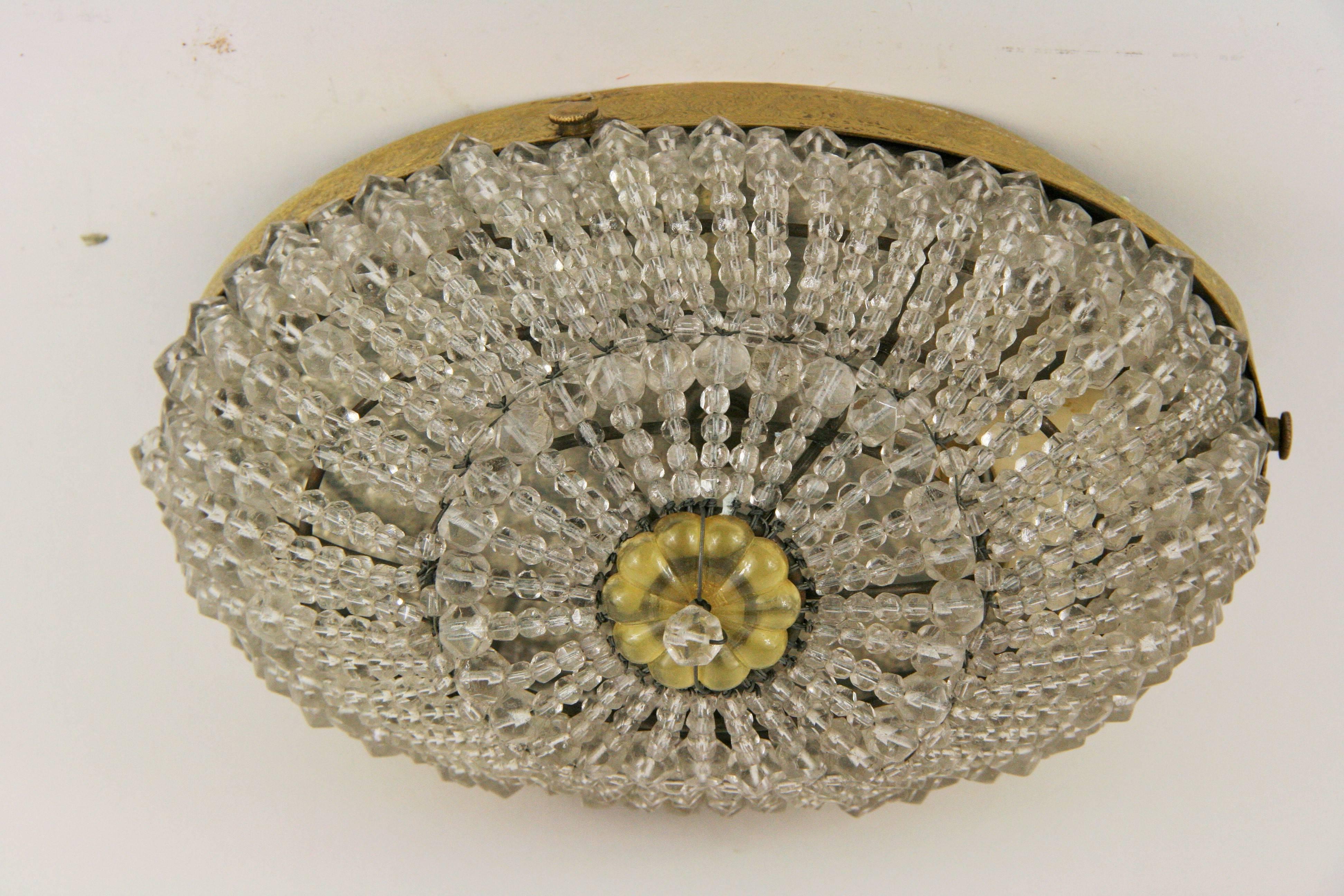 1-2965, a brass and crystal flush mount, circa 1930s.
Takes on 75watt bulb
Newly rewired.
