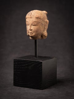 Antique sandstone head of an Apsara statue from India