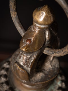 Antique bronze Nepalese temple bell on a wooden stand from Nepal