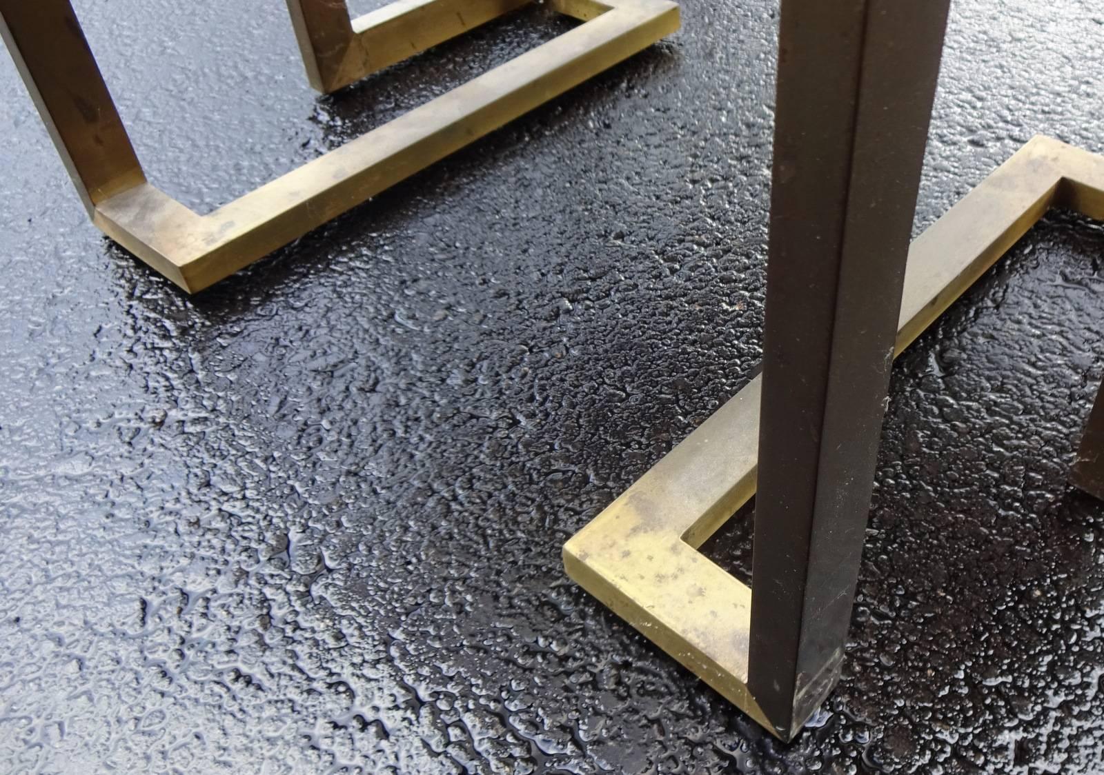 Neoclassical brass nesting tables with smoked glass 
Original condition, metal would need polishing.