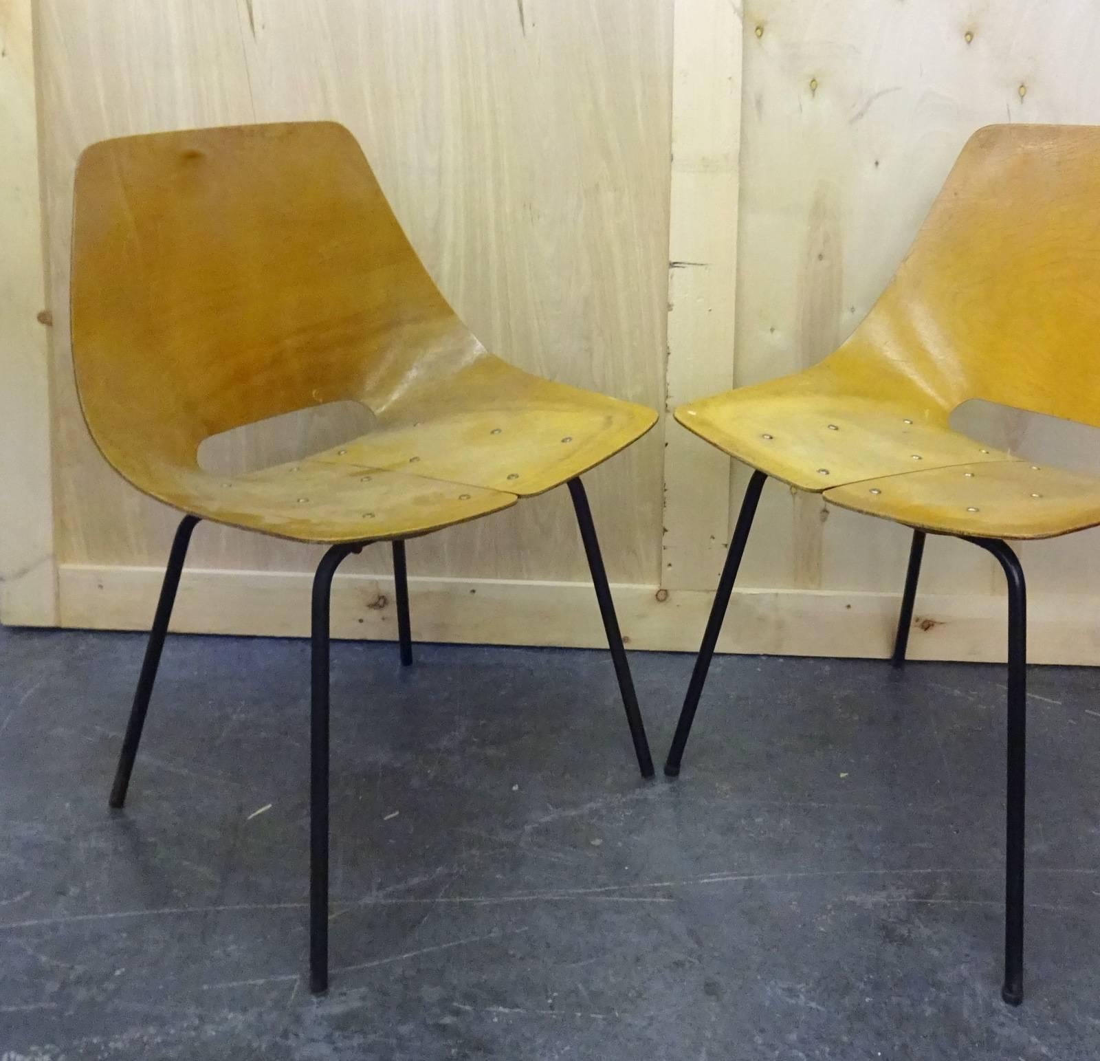 Bent plywood chairs in original condition from the 1950s missing their original upholstery 
Located in Brooklyn.
 