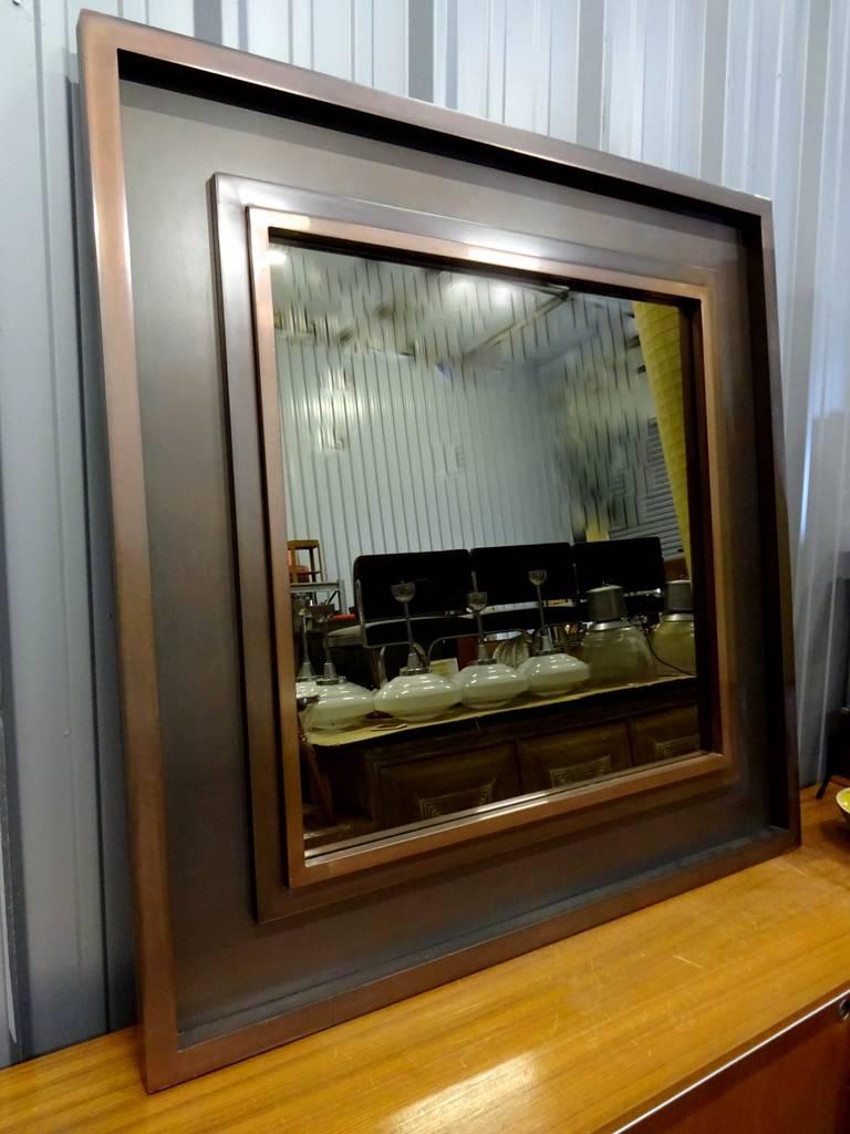 Unique mirror with a copper patina, circa 1970.
Matching console available 