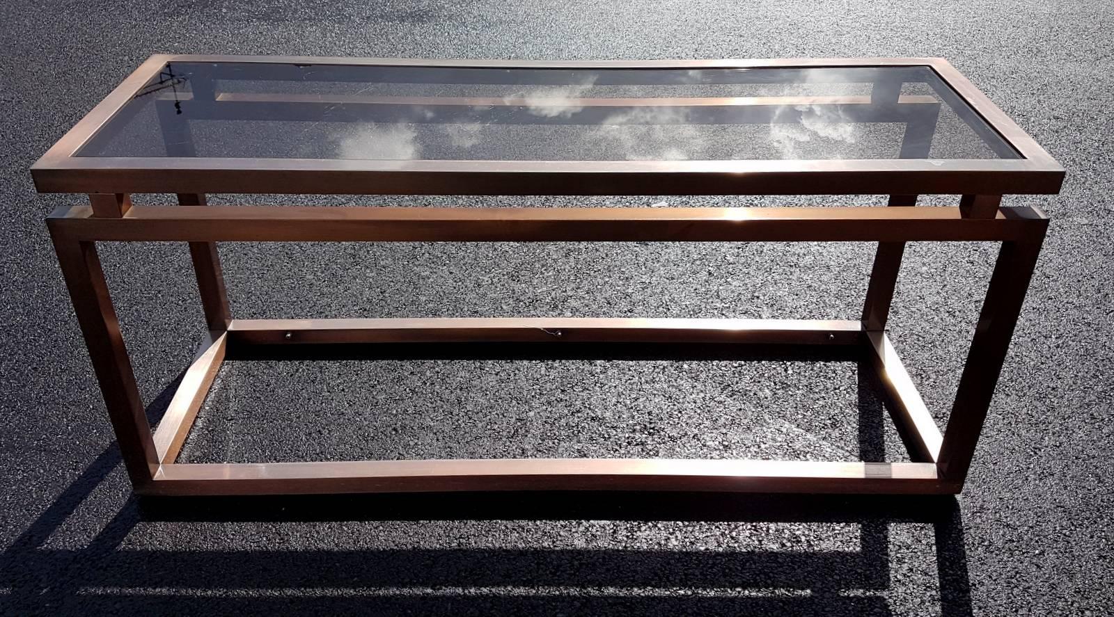 Nice copper finish console with smoke glass, matching mirror available.
