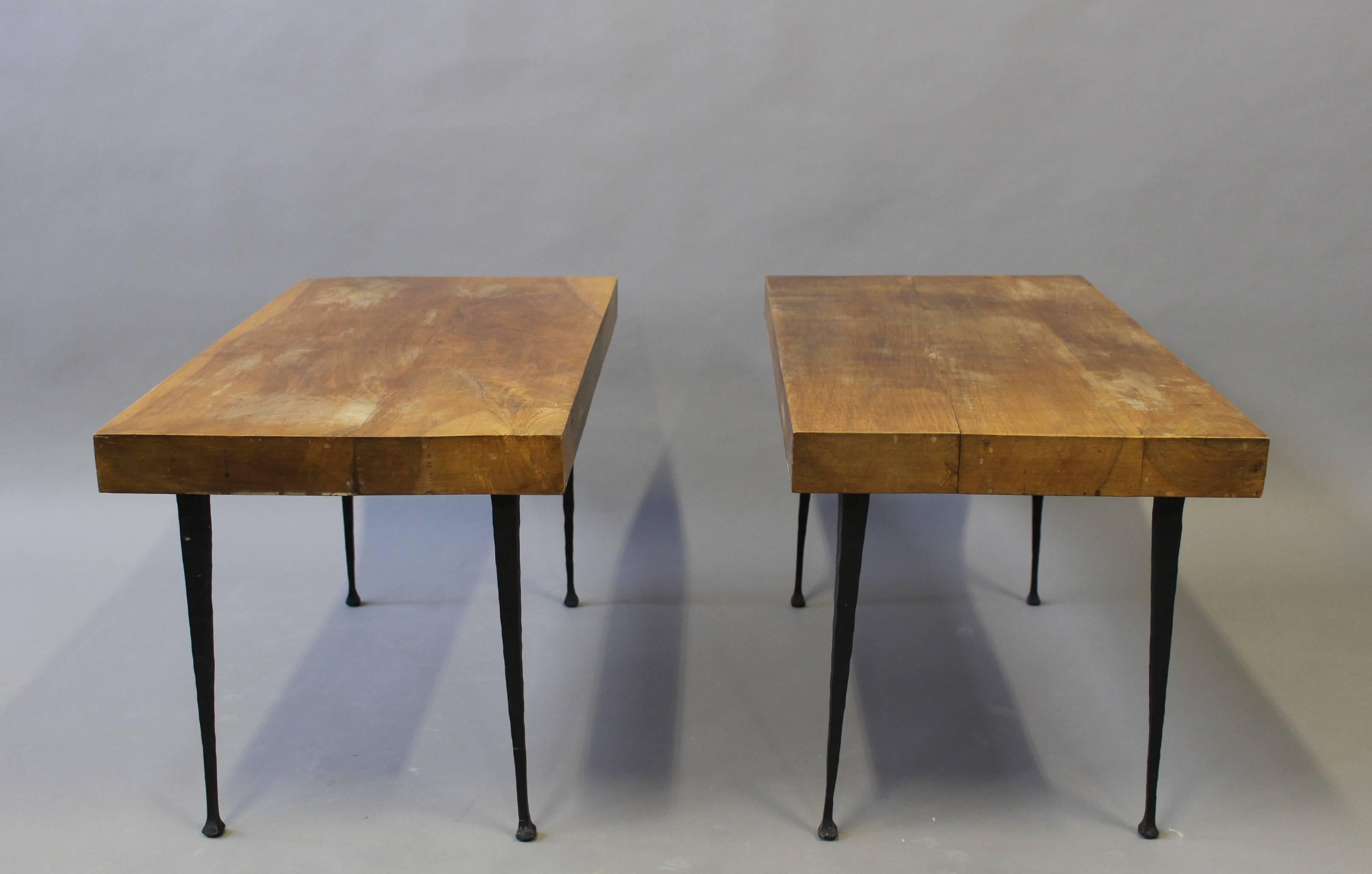A pair of fine French Art Deco wrought iron legs coffee table with solid walnut tops. Might be used as small benches or stool.
Signed on leg (unknown by us).

             