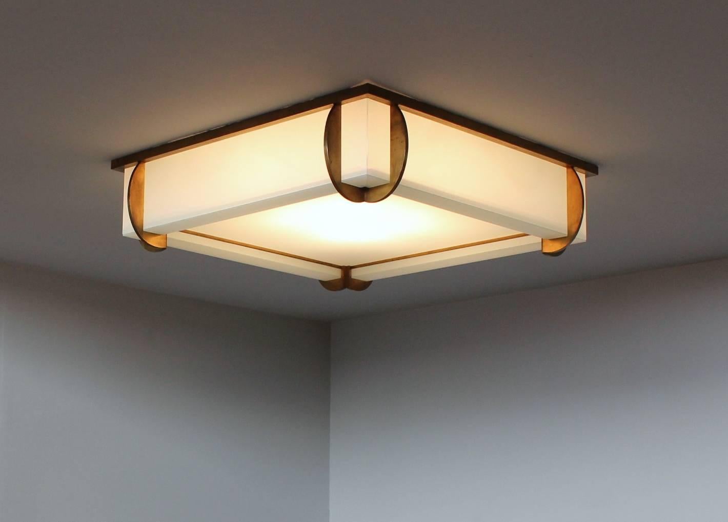 with bronze curved blades on each corner. The bottom square glass diffuser is easy to remove for bulb replacement.