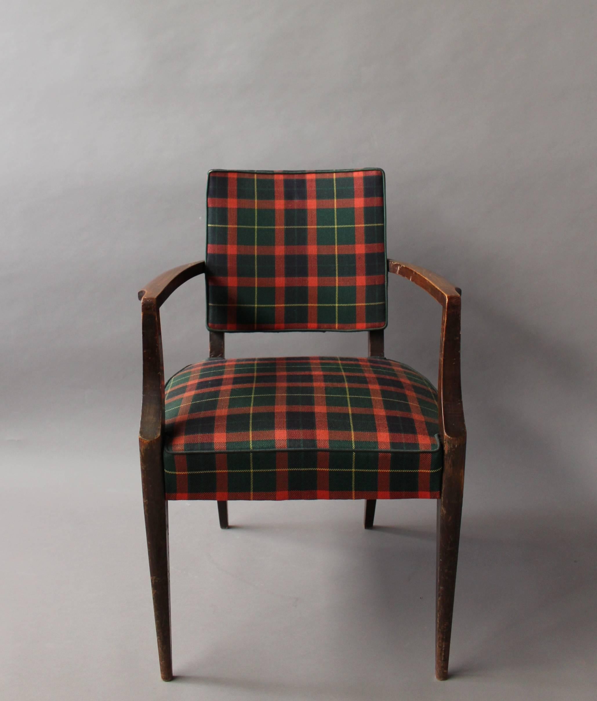 French Art Deco darkened beech wood bridge armchair with a Tartan fabric.