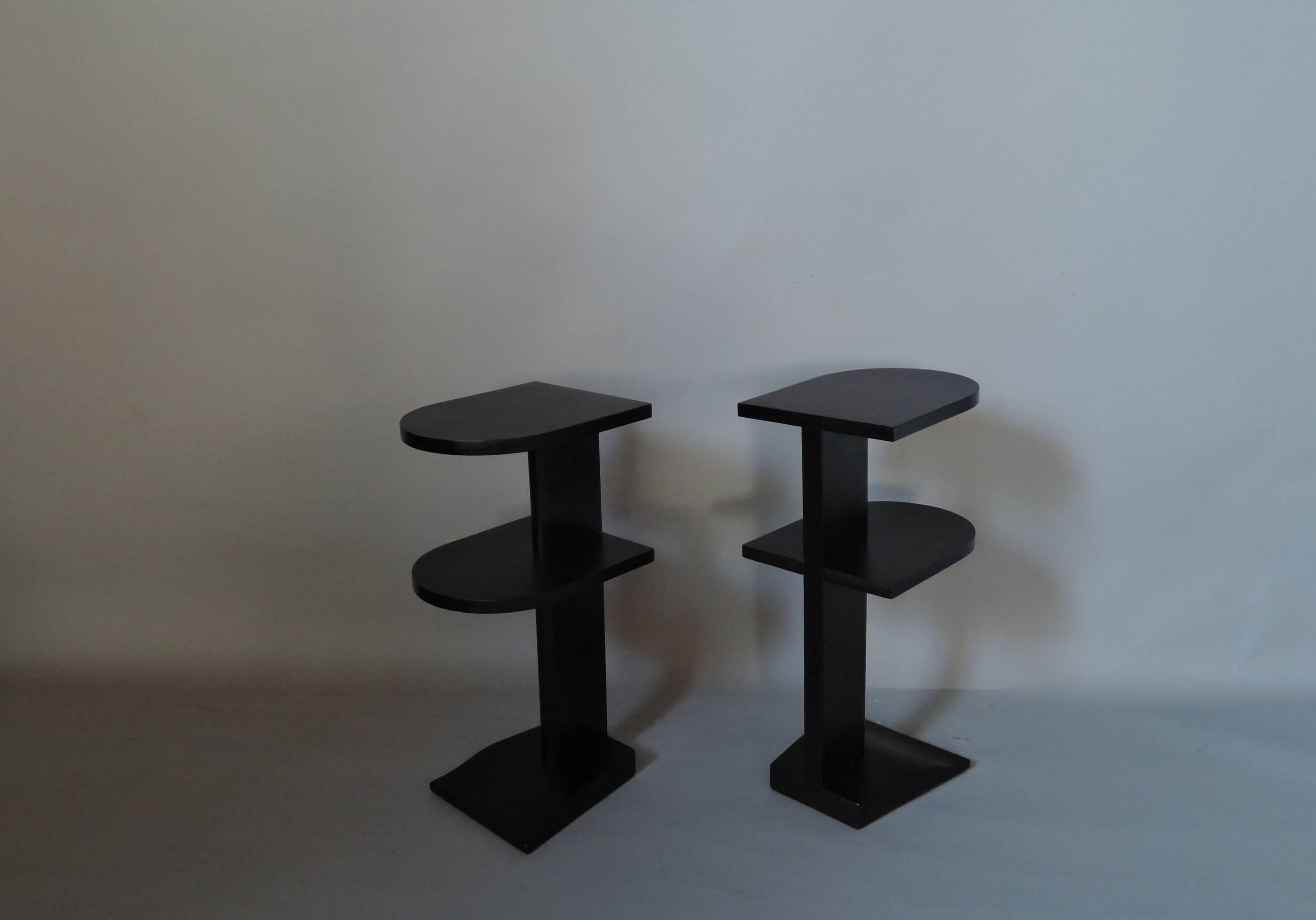 Pair of French Art Deco two-tiered darkened sycamore side or end tables.