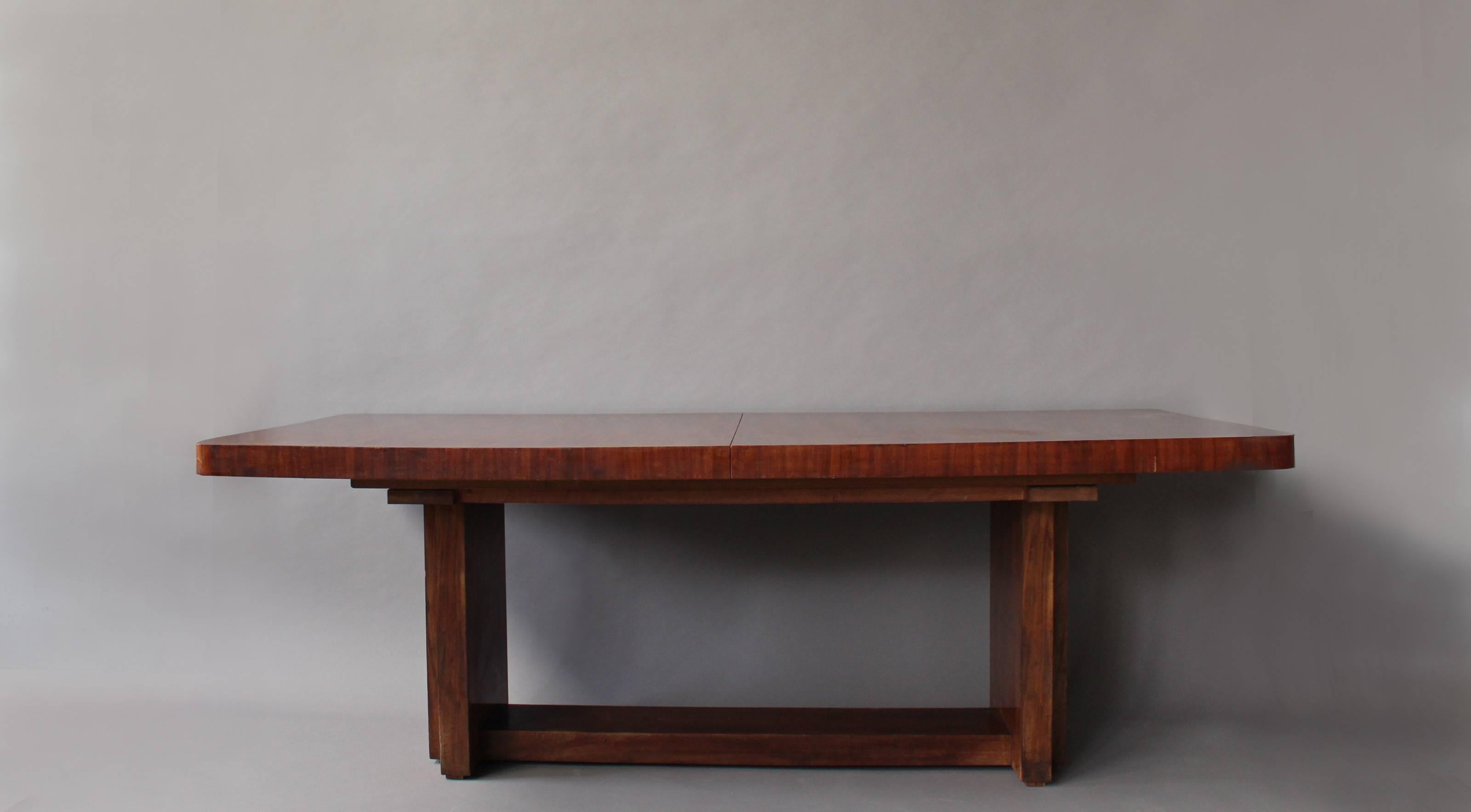 A Fine French Art Deco extendable mahogany modernist dining table.
Possibility of center extension leaves (they are missing).
