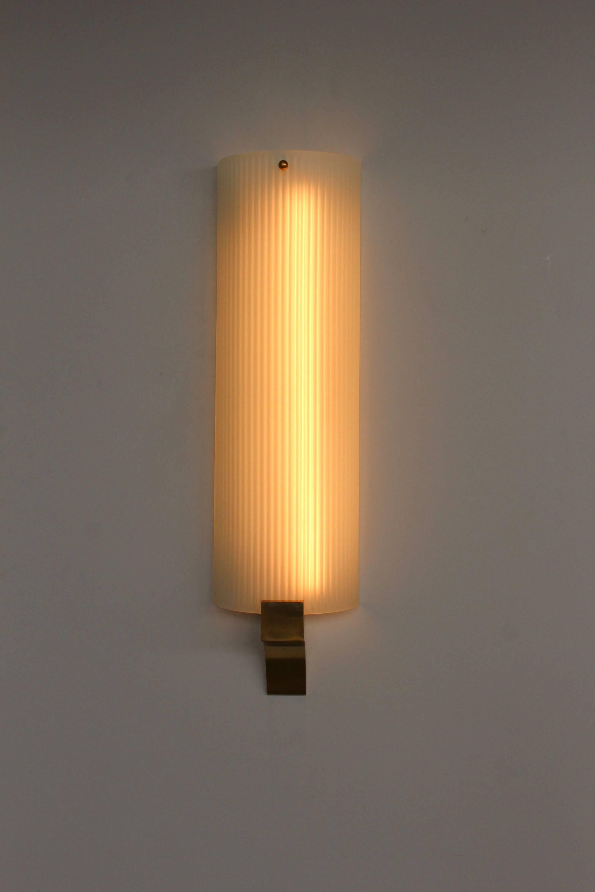 Fine French Art Deco fluted and frosted glass shade on a bronze base sconce by Jean Perzel.