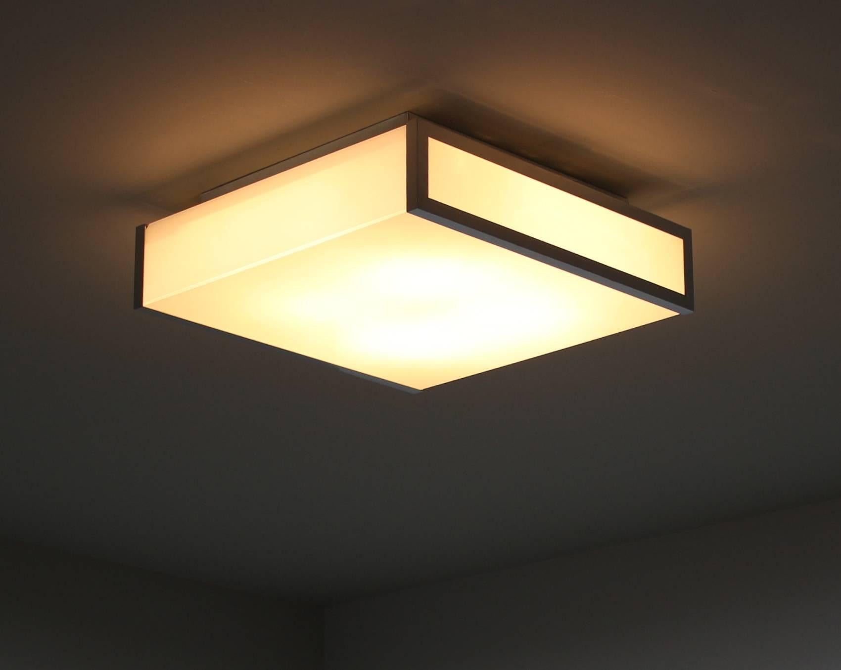With Minimalist chromed frame that support the white enameled glass which diffuses a nice bright light.
Can be used as a ceiling or wall light.
 
