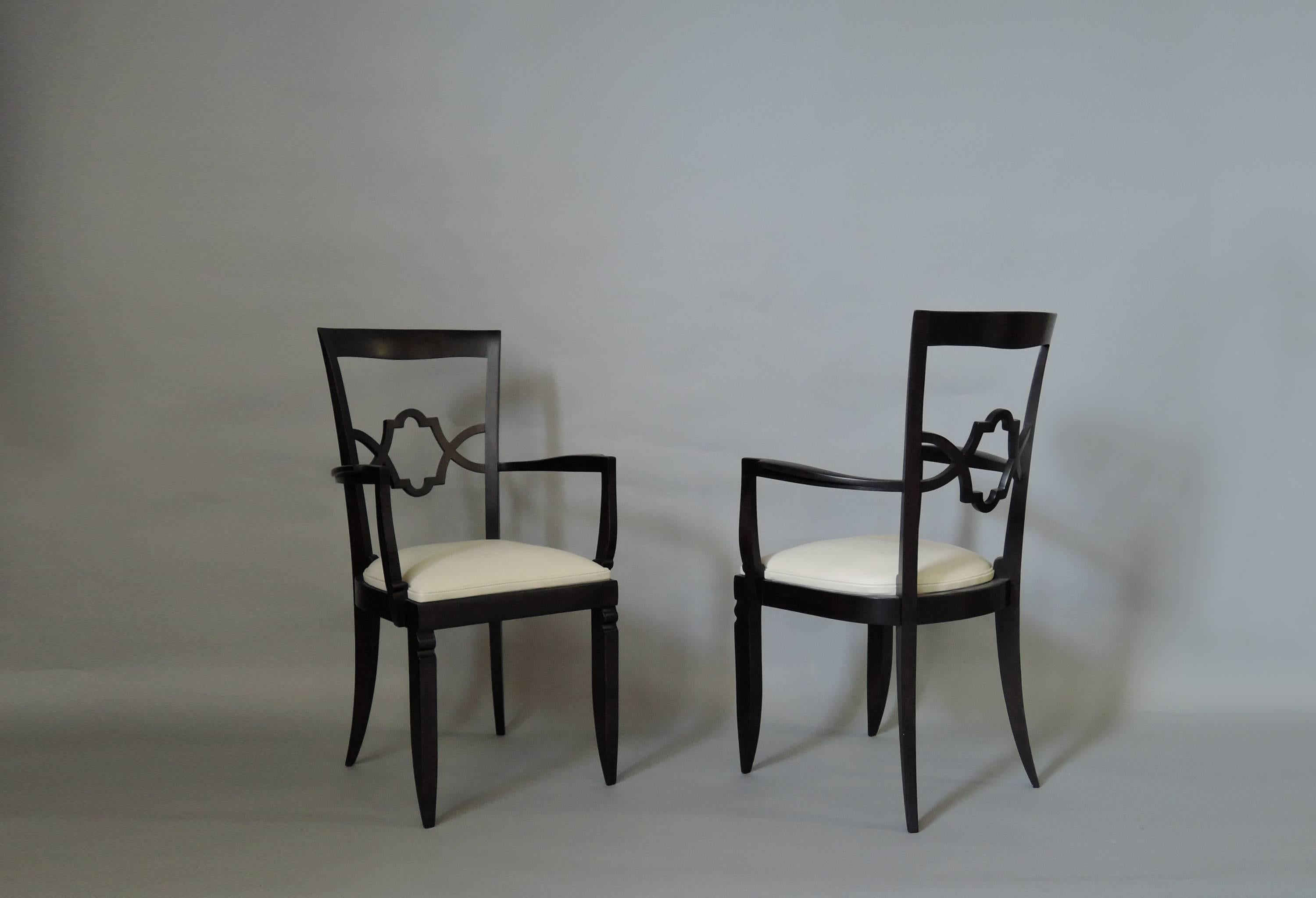 With ebonized wood frames and leather upholstered seats, in the manner of Jules Leleu.
Two more chairs requiring touch up and small restorations are also available.