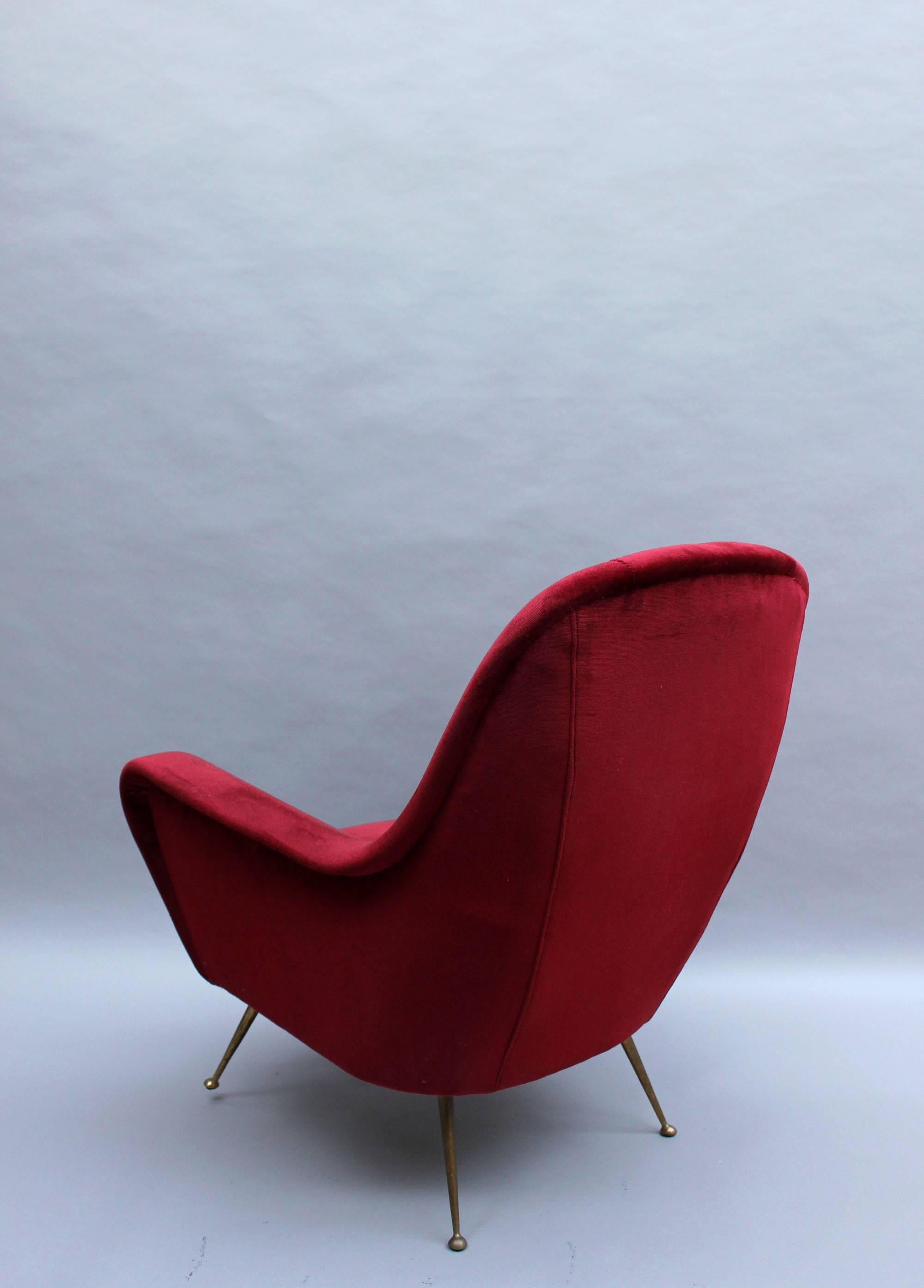 A Fine 1970's Italian Red Velvet Armchair with Brass Legs In Good Condition For Sale In Long Island City, NY