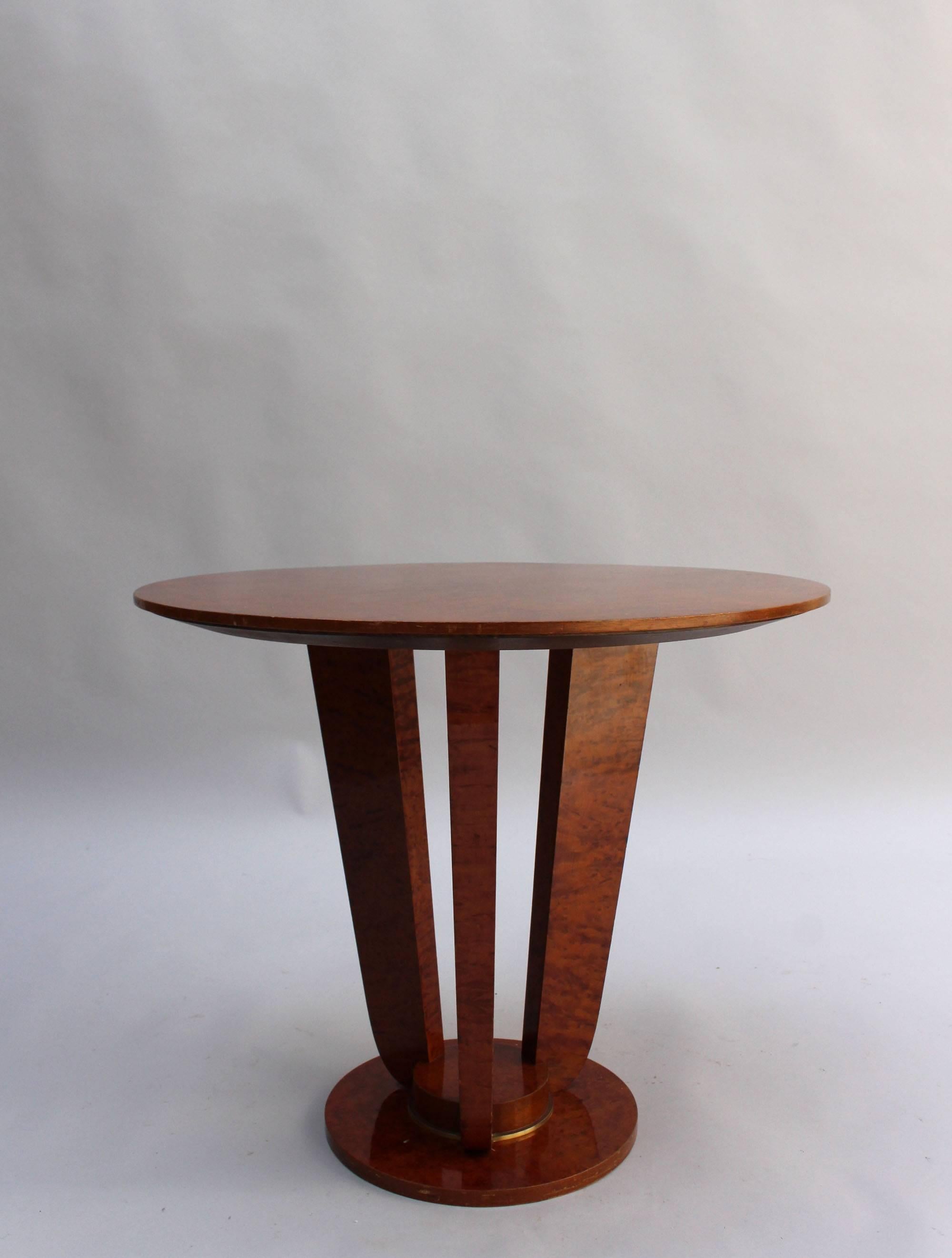 A fine French Art Deco burl elm gueridon - side table with brass detail on a three legs pedestal base.
 