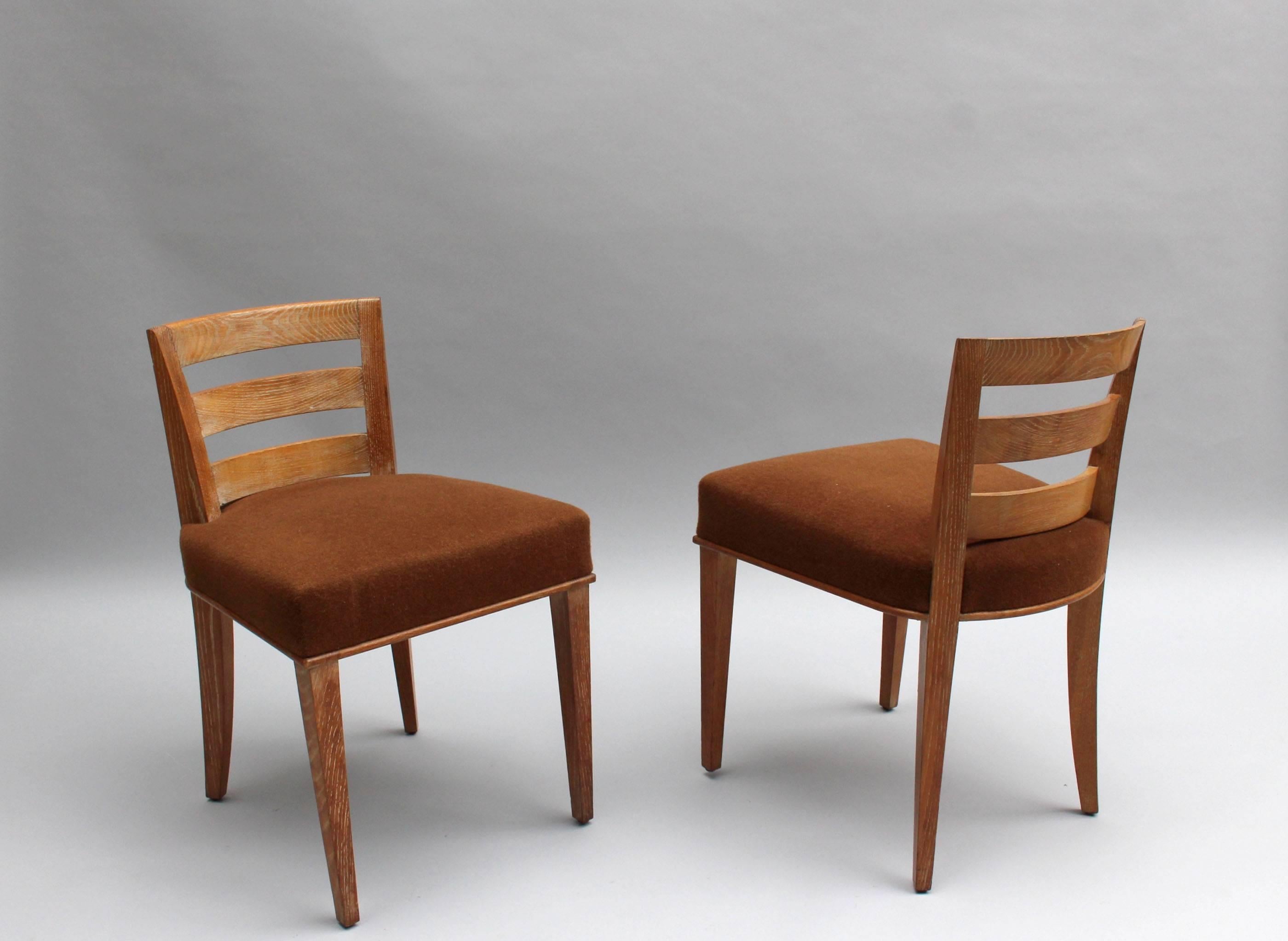 Pair of fine French Art Deco low back lime oak side chairs by André Domin and Marcel Genevrière (Dominique).
Documented in magazine 