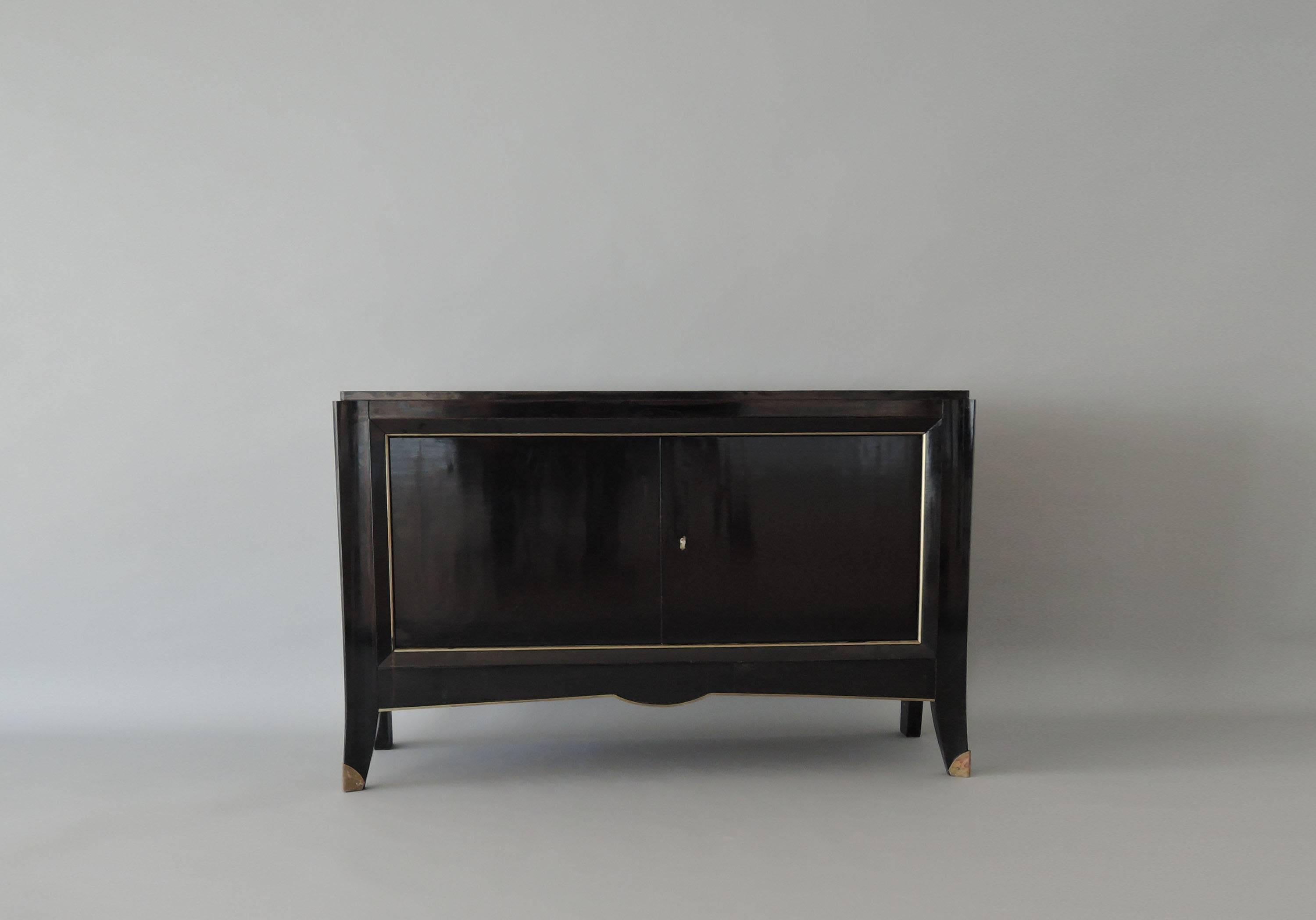 French Art Deco black lacquered two door buffet/commode with bronze details.