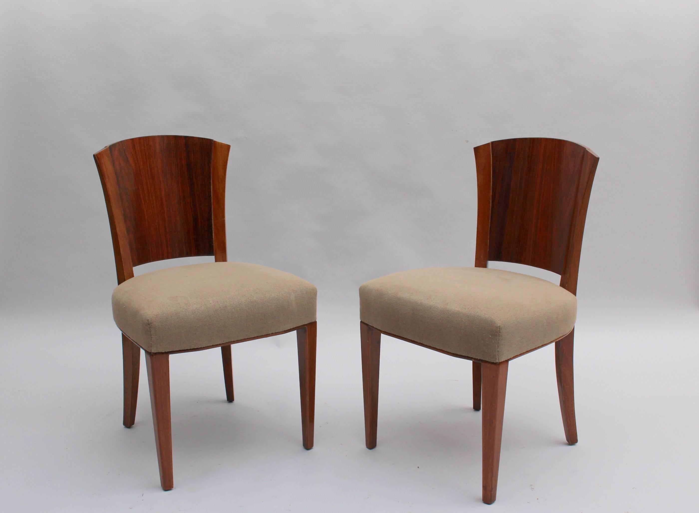 Maison Dominique (founded in 1922 by André Domin and Marcel Genevriere):

A set of four fine French Art Deco side/dining chairs by Dominique, with a solid mahogany frame, a rosewood veneered back and upholstered seats .

Documented page 90 of the