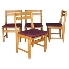 Ensemble de 4 chaises de salle à manger en chêne des années 1970 par Guillerme & Chambron