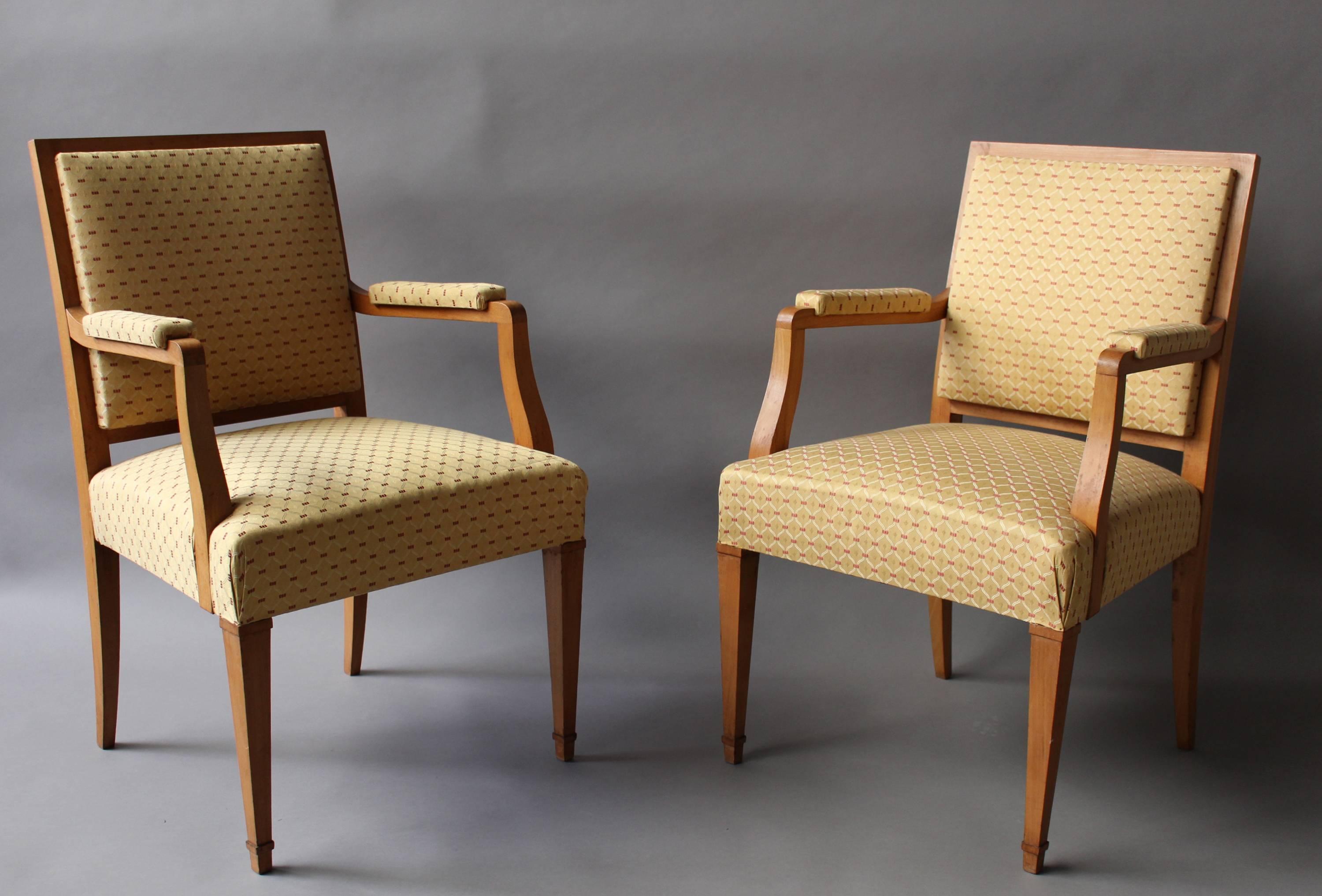 A pair of fine French Art Deco beechwood bridge armchairs. 
