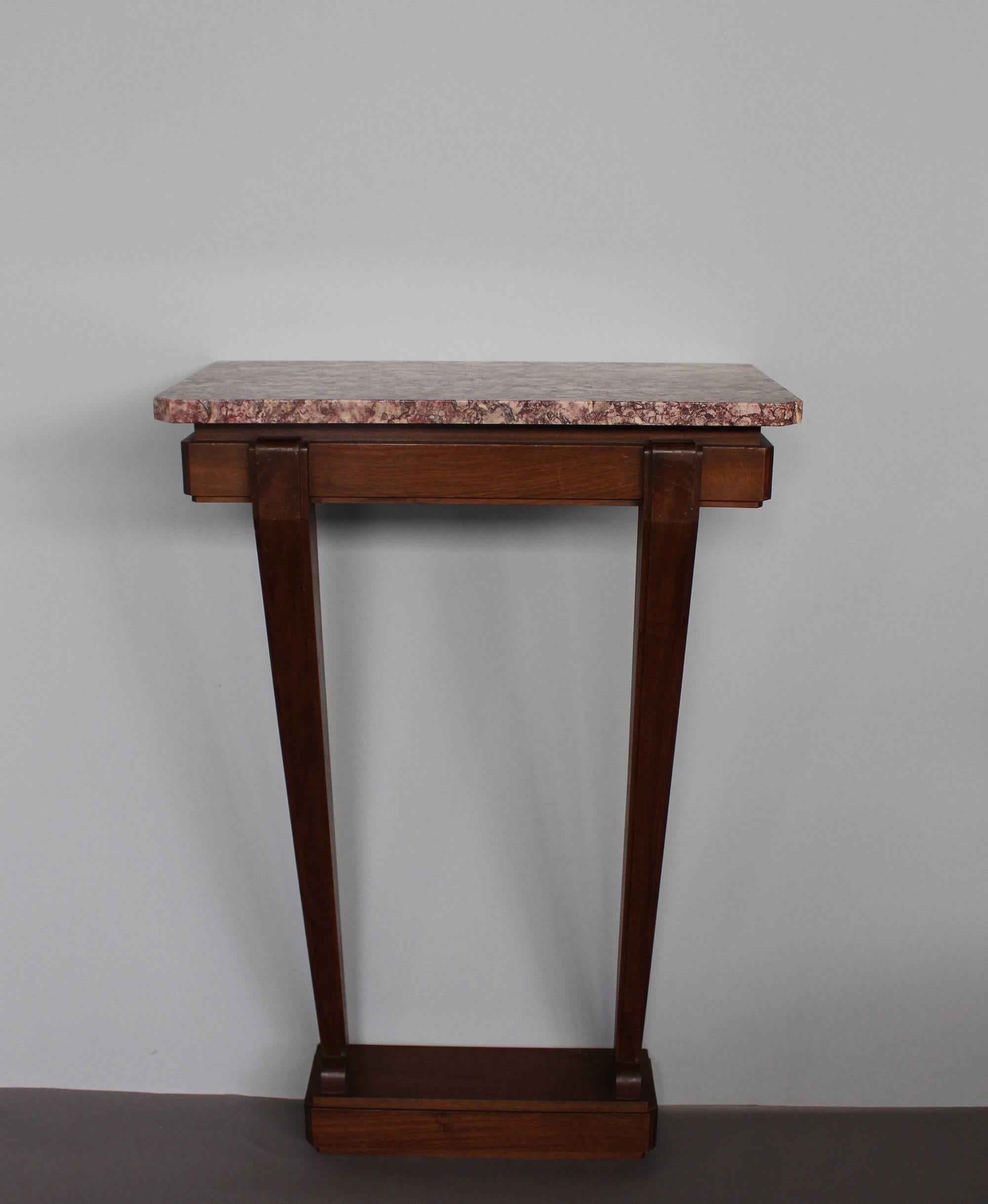 A fine French Art Deco console with a mahogany pedestal and a marble top.
