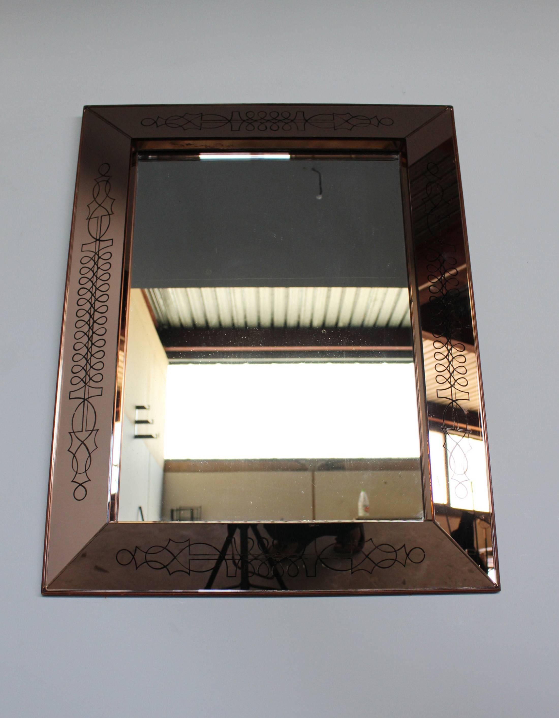 A fine French Art Deco engraved and stained rectangular mirrored framed mirror by Max Ingrand.
Documentation: Max Ingrand 