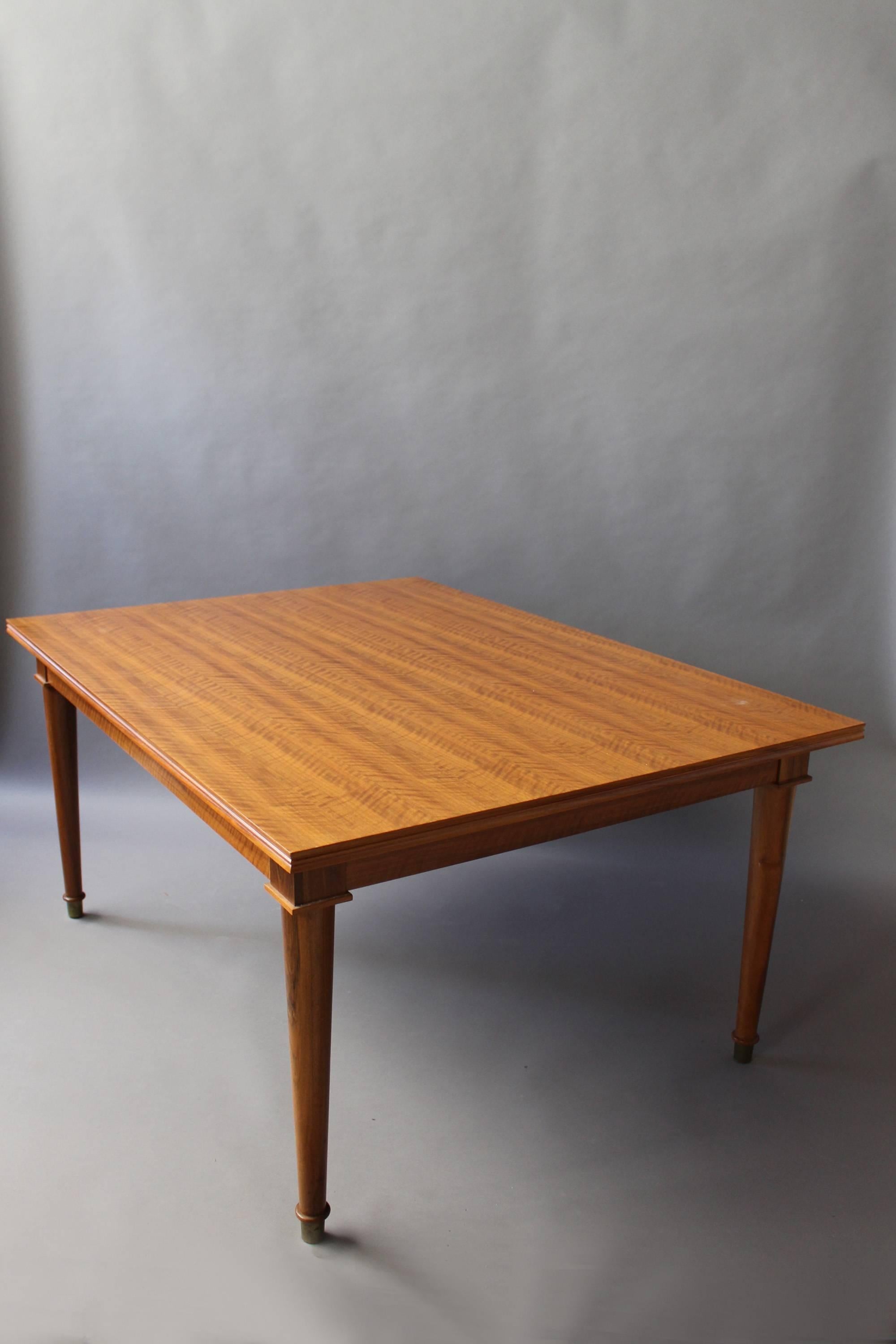 20th Century A Fine French Art Deco Extendable Walnut Dining Table by Jules Leleu