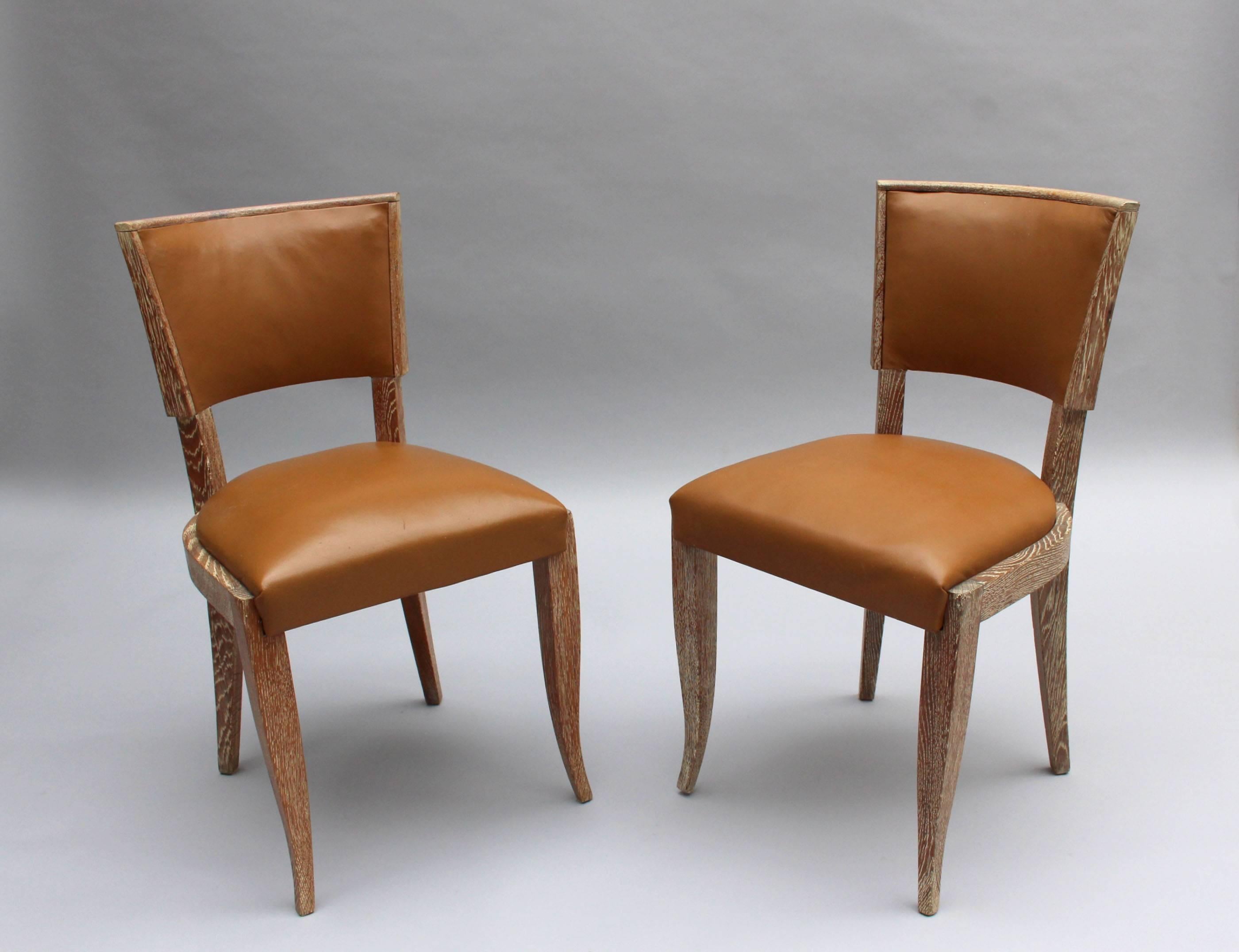 Set of 14 fine French Art Deco lime oak chairs.

 
 