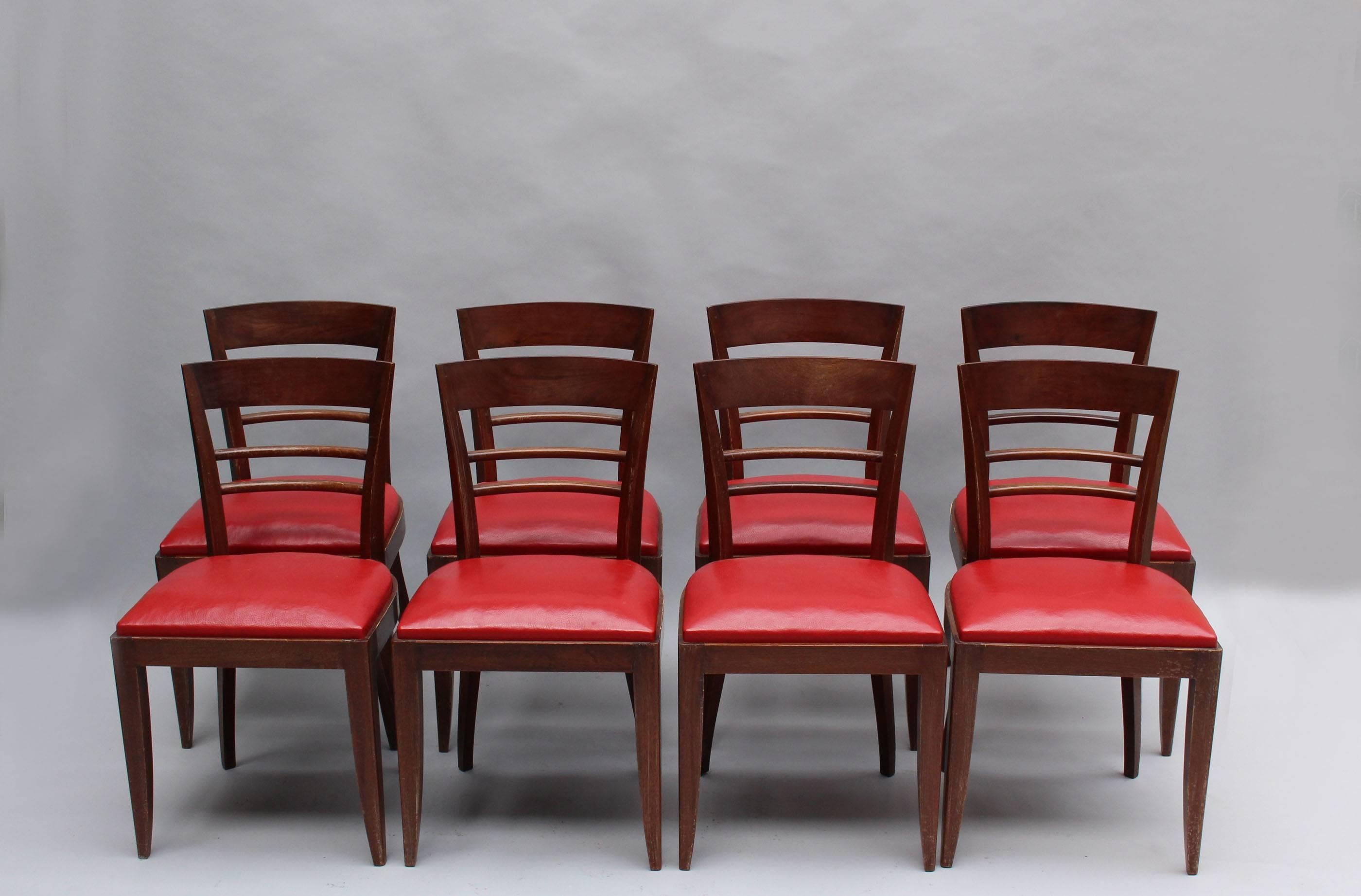A set of ten fine French Art Deco mahogany dining chairs (8 side + 2 arm)
Dimensions:
Side H 32”1/2 x W 18”1/8 x D 19”5/8
Arm H 32”7/8 x W 22”7/8 x D 21”1/2.
Seat height 18 1/8