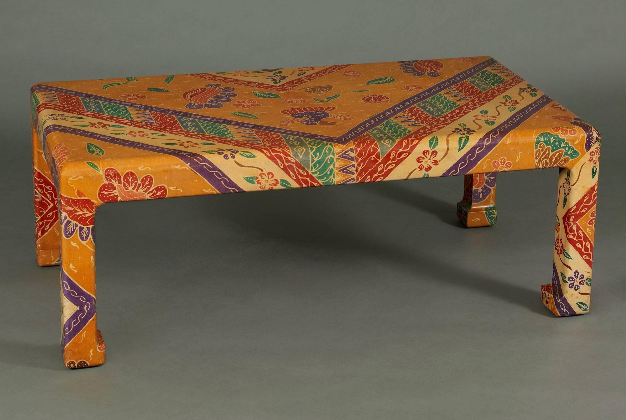 Chinoiserie low table with Asian-inspired feet wrapped in multi-color Matisse-like batik fabric. Signed with original leather label underneath top.