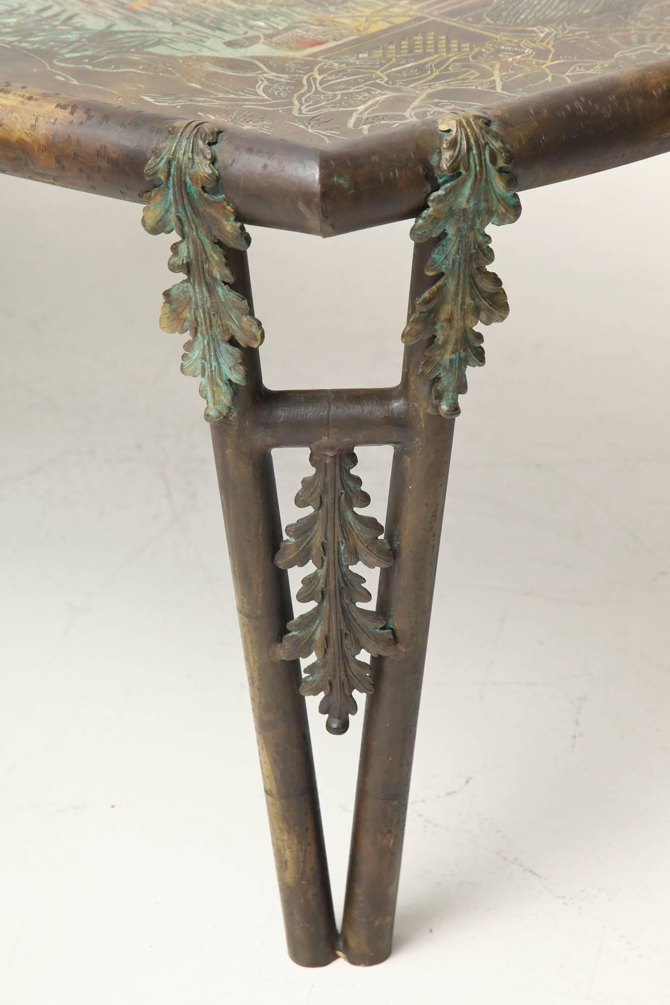 Philip (1908-1988) and Kelvin (b. 1936) LaVerne
Lozenge shaped cocktail low table in patinated brass over pewter
with acid-etched and enameled “T'ang” coastal fishing village scene on top. 
Tapering paired legs with applied leaf