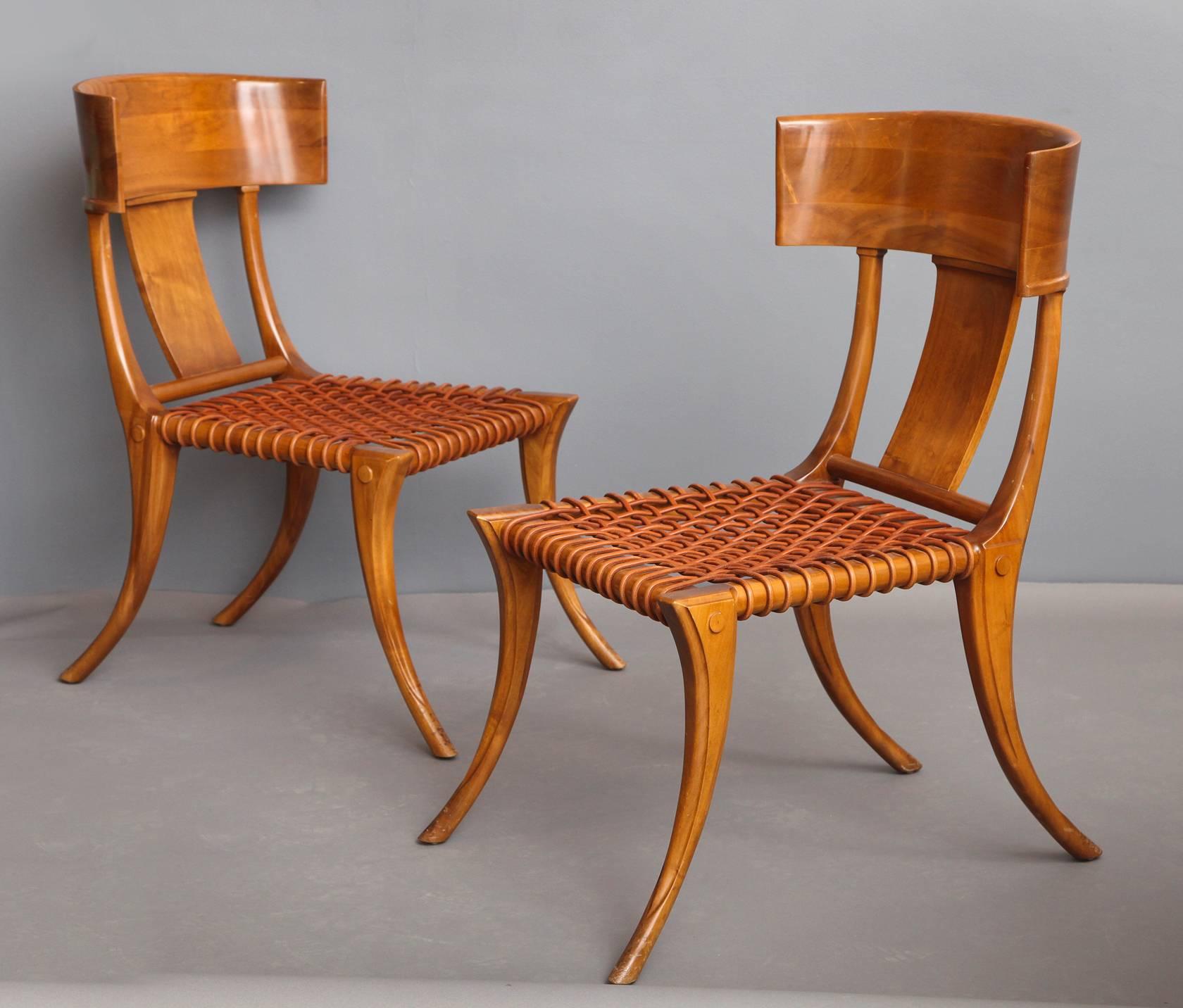 T.H. Robsjohn-Gibbibgs (1905-1976)
Pair of birch side chairs in classical Klismos style with woven leather seats.
Executed by Saridis, Athens
American, circa 1965

This chair model is notably documented on the cover of 