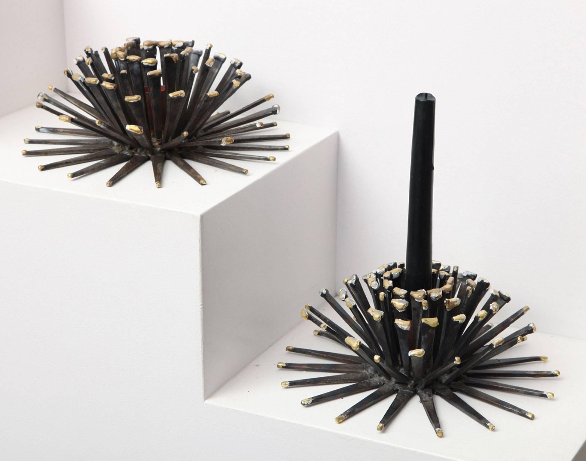 Made expressly for Liz O'Brien by Marie Suri, these anemone candleholders are handcrafted in steel with bronze decoration and a copper interior.
Festive for holiday tables and parties, these holders take a standard tapering candles. They are also