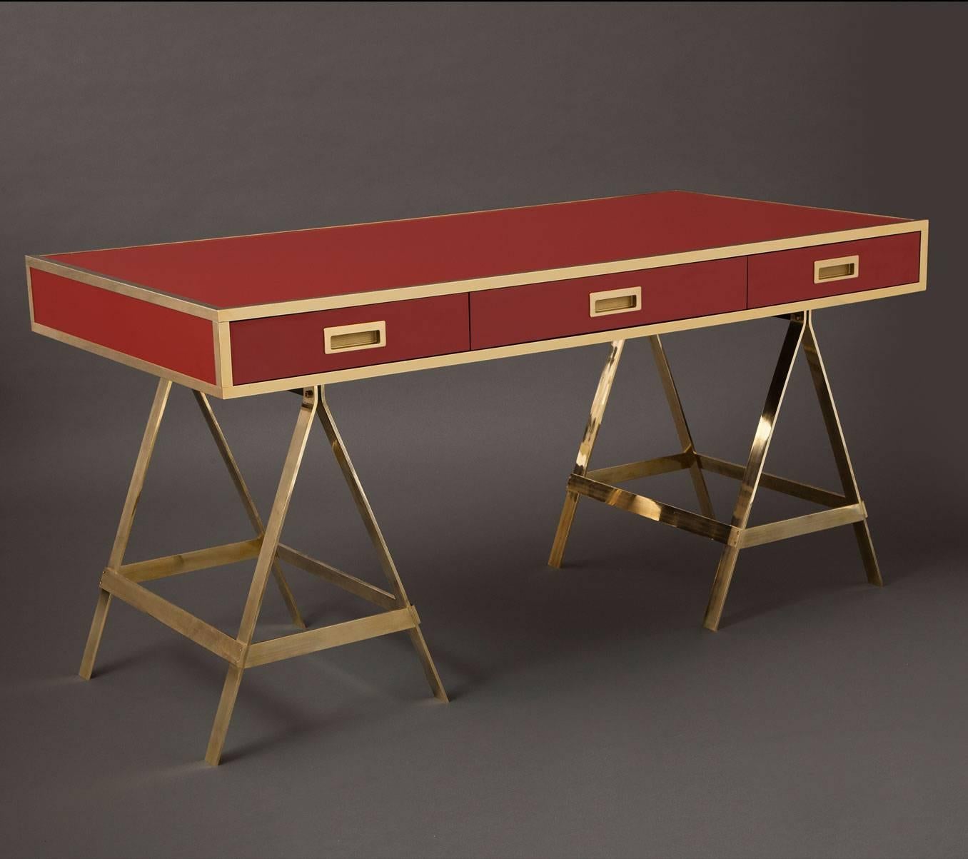The Albrizzi Desk
Trestle desk in matte laminate with three dovetailed drawers and inset pulls. Unlacquered brass trim and saw horse legs that will patina over time. 
Laminate available in a full spectrum of colors.
Made expressly for Liz O'Brien