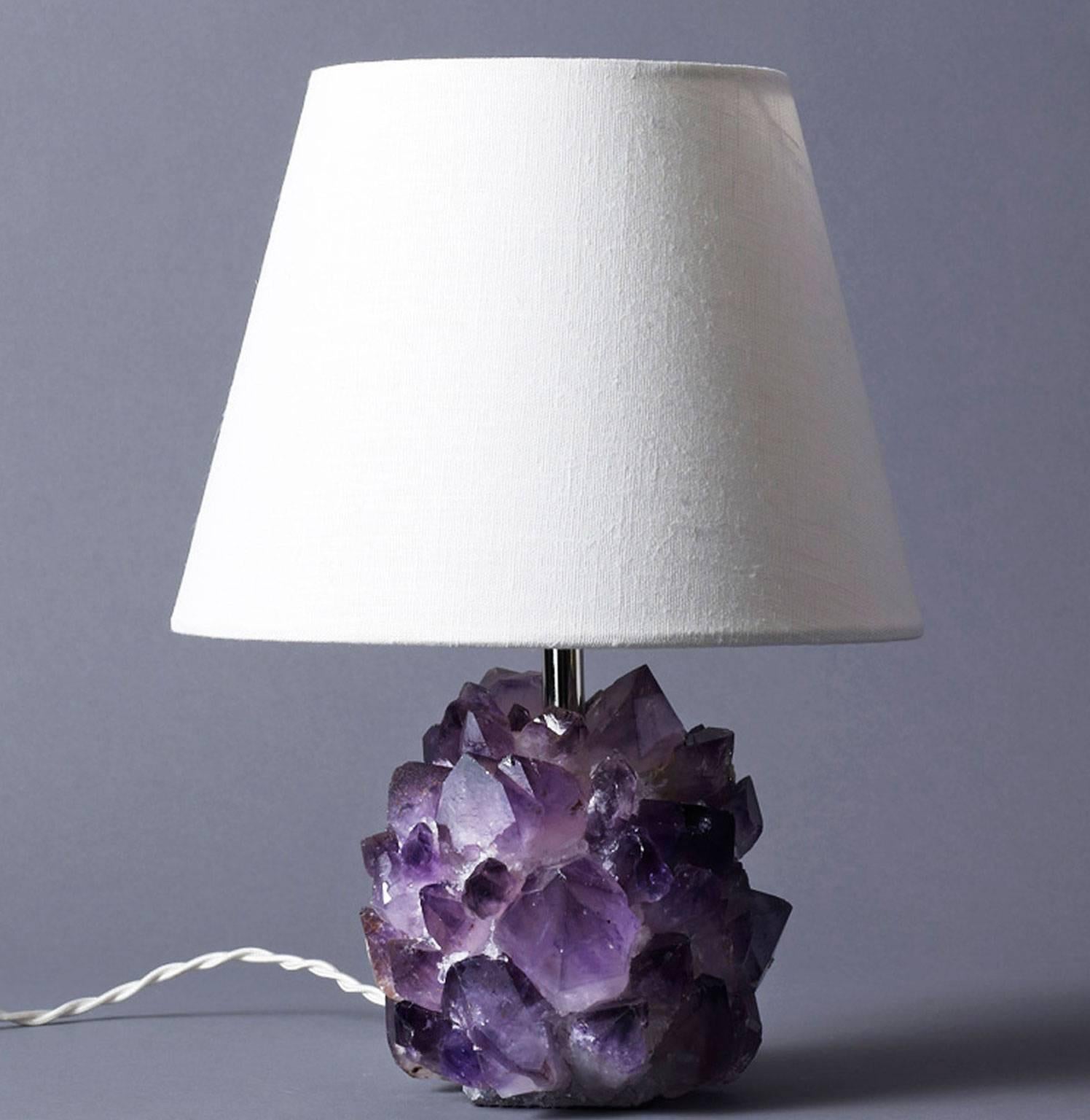 Liz O'Brien Editions
Pair of small-scale table lamps in natural amethyst rock crystal with twisted silk cord in a variety of colors. Lampshade not included.
Made to order. Can be purchased as a single or as a pair.