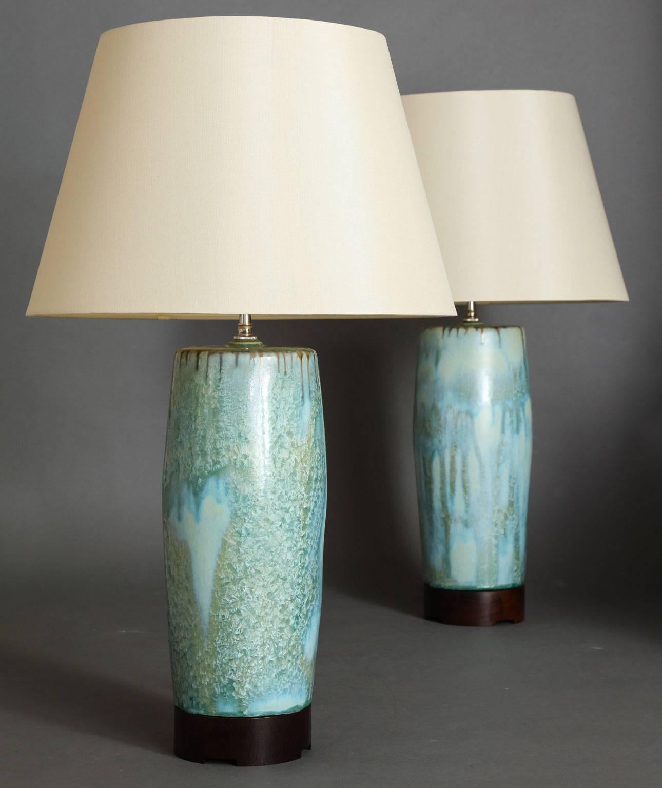 Bulldog table lamp.
Pair of hand-formed ceramic lamp base available in many beautiful glazes, 
with optional wood bases available in two heights and a variety of wood finishes. Wired with two-bulb cluster in either antique brass or polished