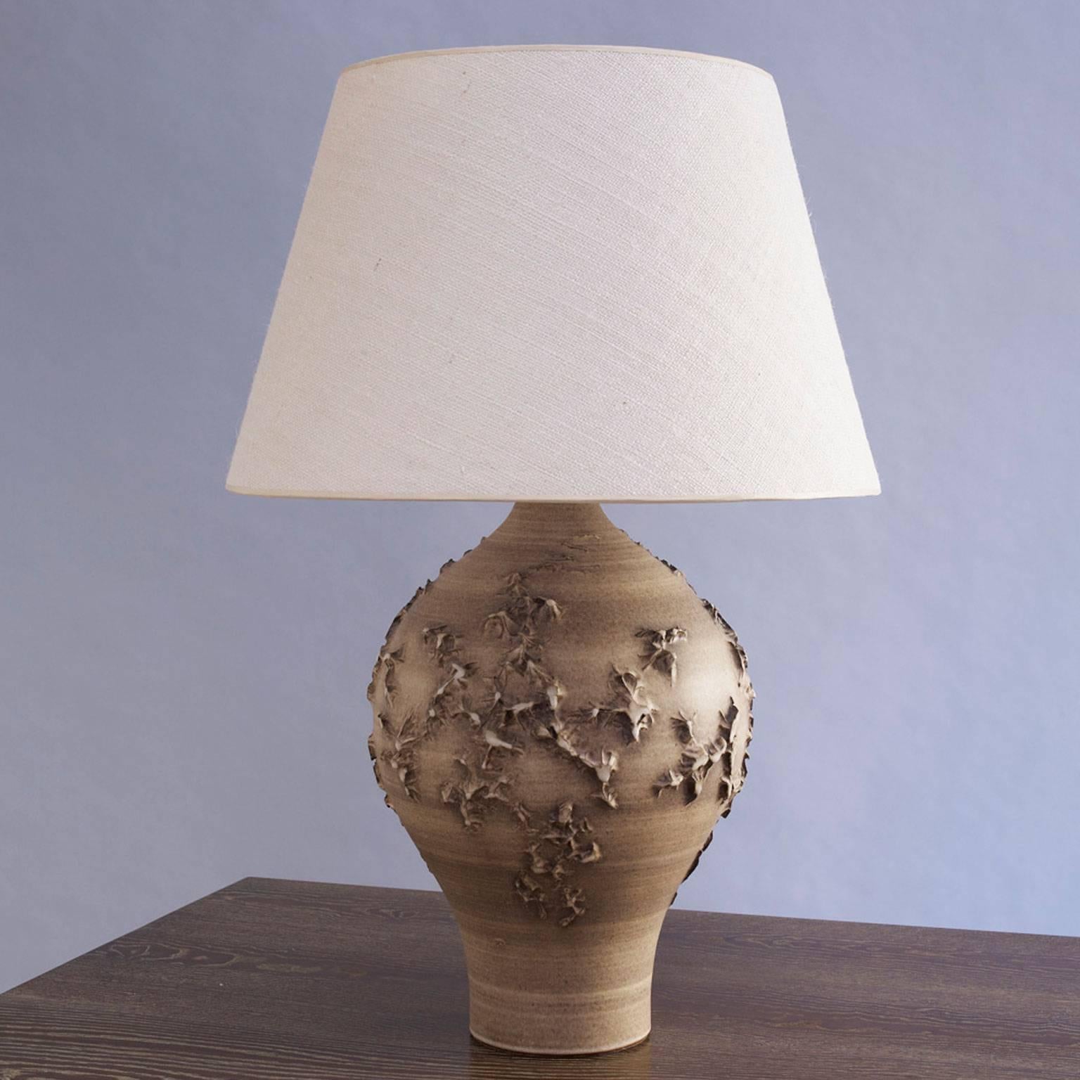 Design Technics
Ceramic lamp with applied decoration
in matte chesnut glaze.
Signed with DT mark.
American, circa 1950.
