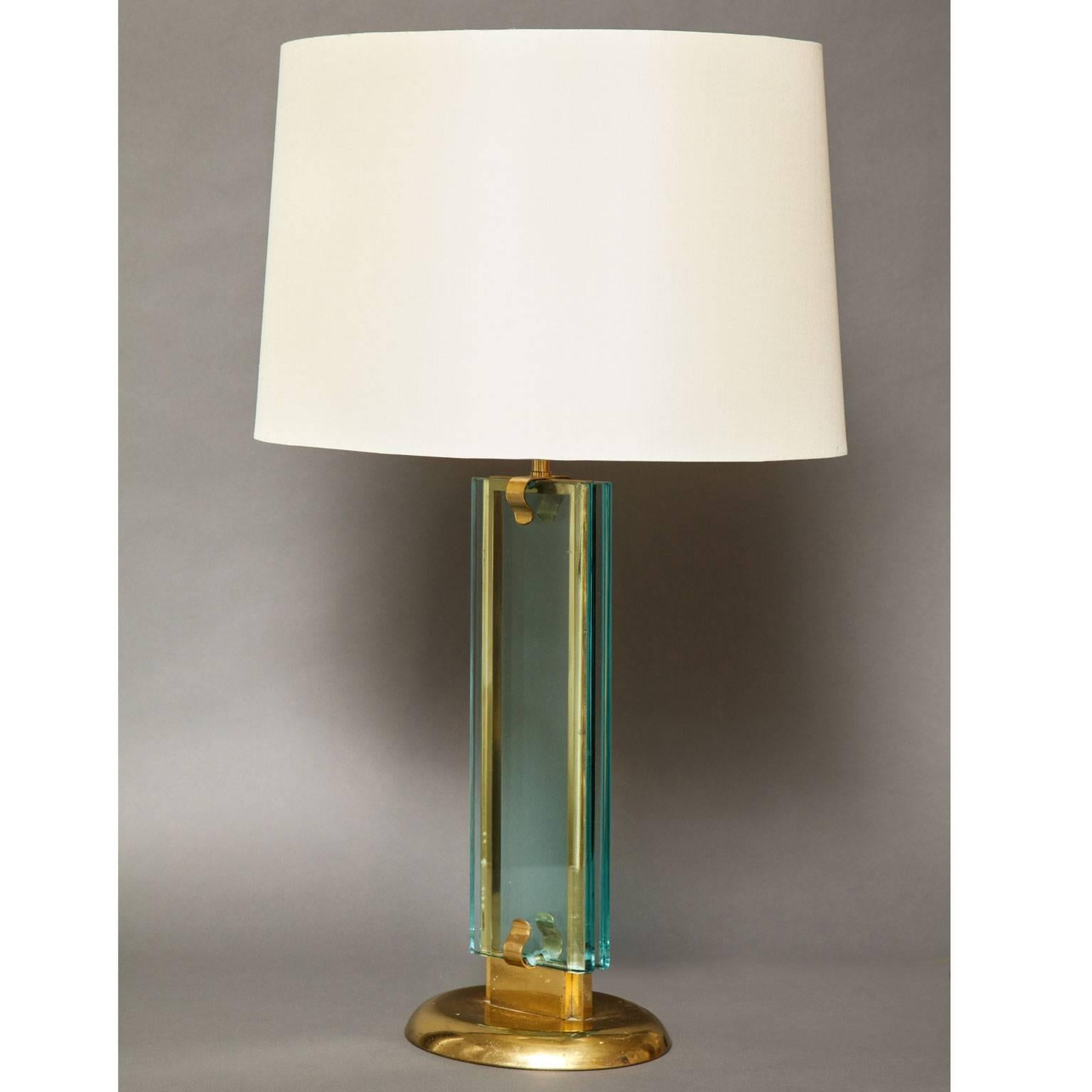 Max Ingrand (1908-1969)
Table lamp with two green beveled glass slabs mounted to brass
fittings on a domed brass base. Executed by Fontana Arte.
Italian, circa 1950

Measurements:
32” H x 9” W x 6” D.
 