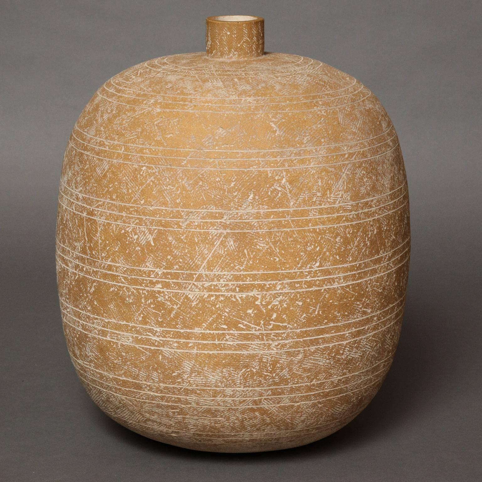 Claude Conover (1907-1994)
"Oaxaca"
Large sculptural unglazed buff colored stoneware vessel, with incised cross-hatch textured surface with matte white details. 
Signed: Claude Conover “Oaxaca”
American, circa 1965

Measurements: