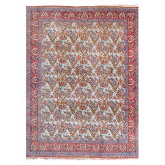 Tapis ancien à motifs floraux de la fin du 19e siècle