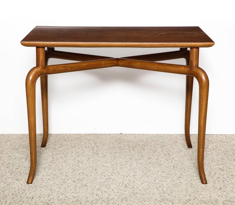 Rectangular walnut top floating on curvy solid walnut dowel structure with tapering legs. A strong example of Gibbings' custom work in the mid-1950s with a bit of eastern influence. 

Provenance: Thomas B. Davis Residence, Rancho Mirage, CA.
 