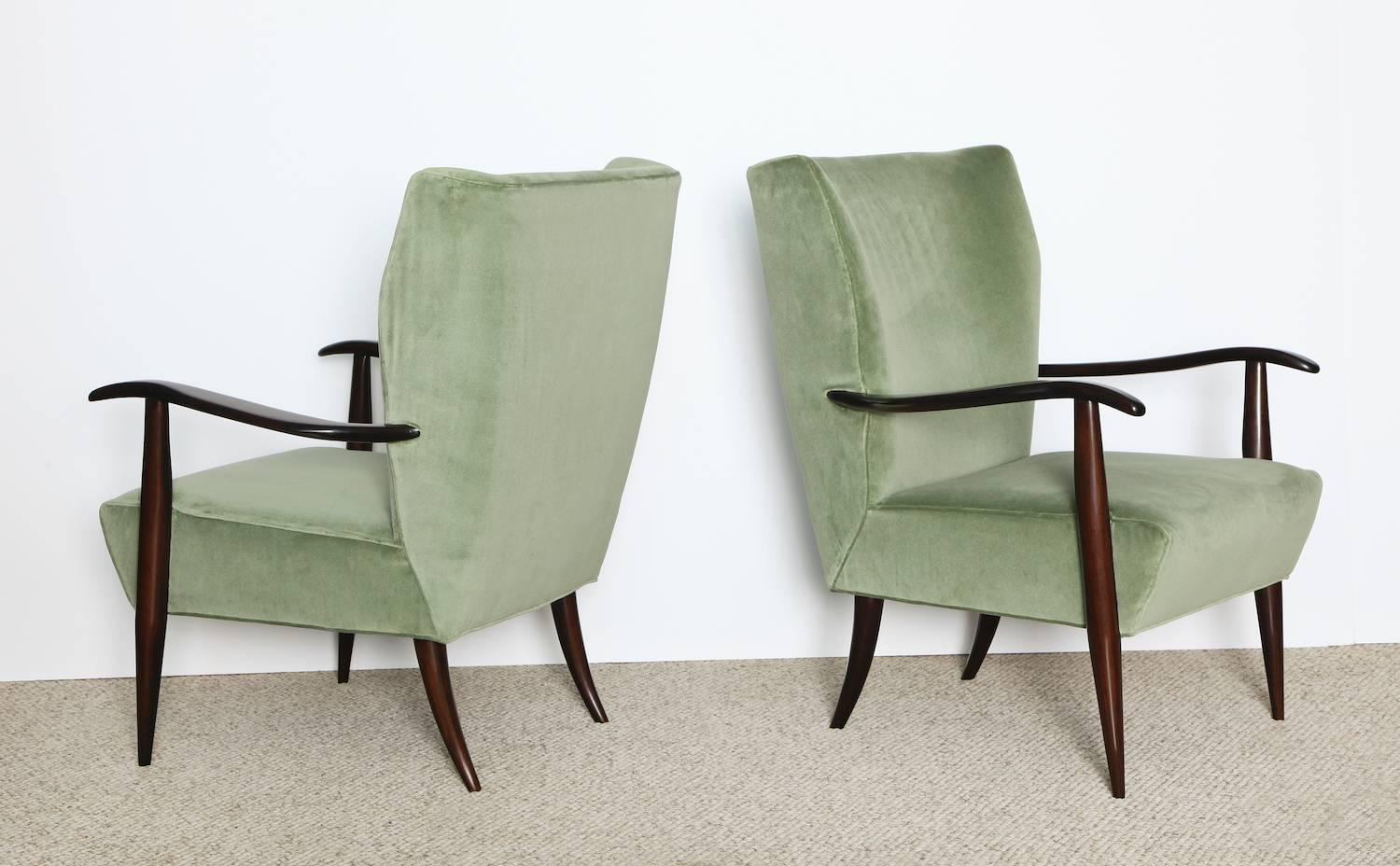 Elegant forms with unusual detailing. Dark stained wood and pale green velvet upholstery.