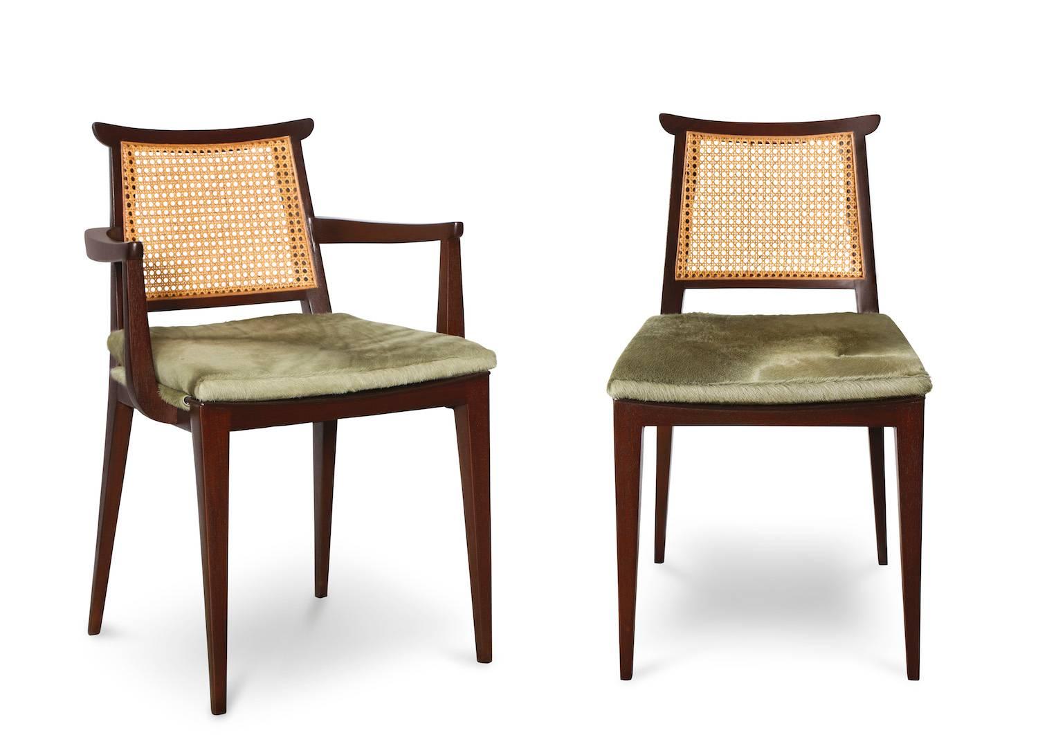 Set of ten dining chairs by Edward Wormley for Dunbar.  Asian-styled dark mahogany chairs with caned backs and removable seat cushions. A great set with two armchairs and eight side chairs. This entire set was recently restored, all seats recovered