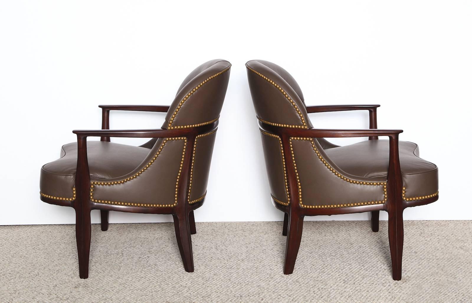 From the Janus Collection. Dark stained mahogany frames with faceted detailing. Cocoa-Brown leather upholstery, with tufting and nail-heads.