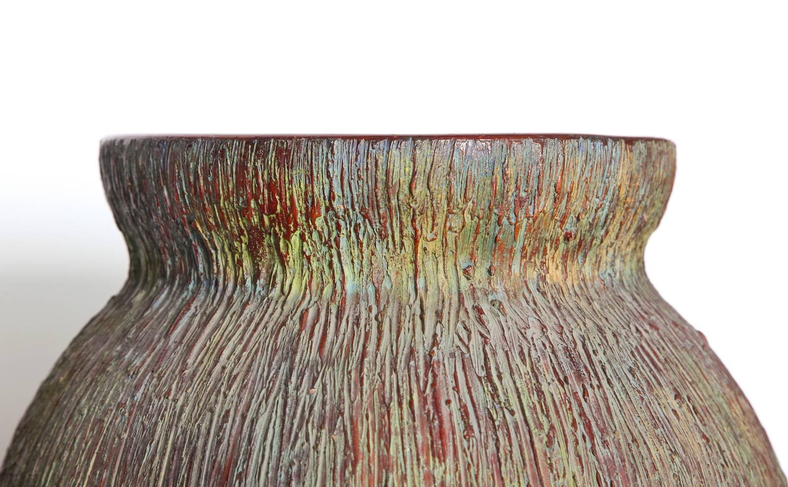Large-scale textured vase by Zaccagnini.  Handmade earthenware vase form with great scale. Roughly textured throughout entire exterior, with multicolored glazes. Interior is smooth with a brown glaze. Signed on underside with manufacturer’s marks.
