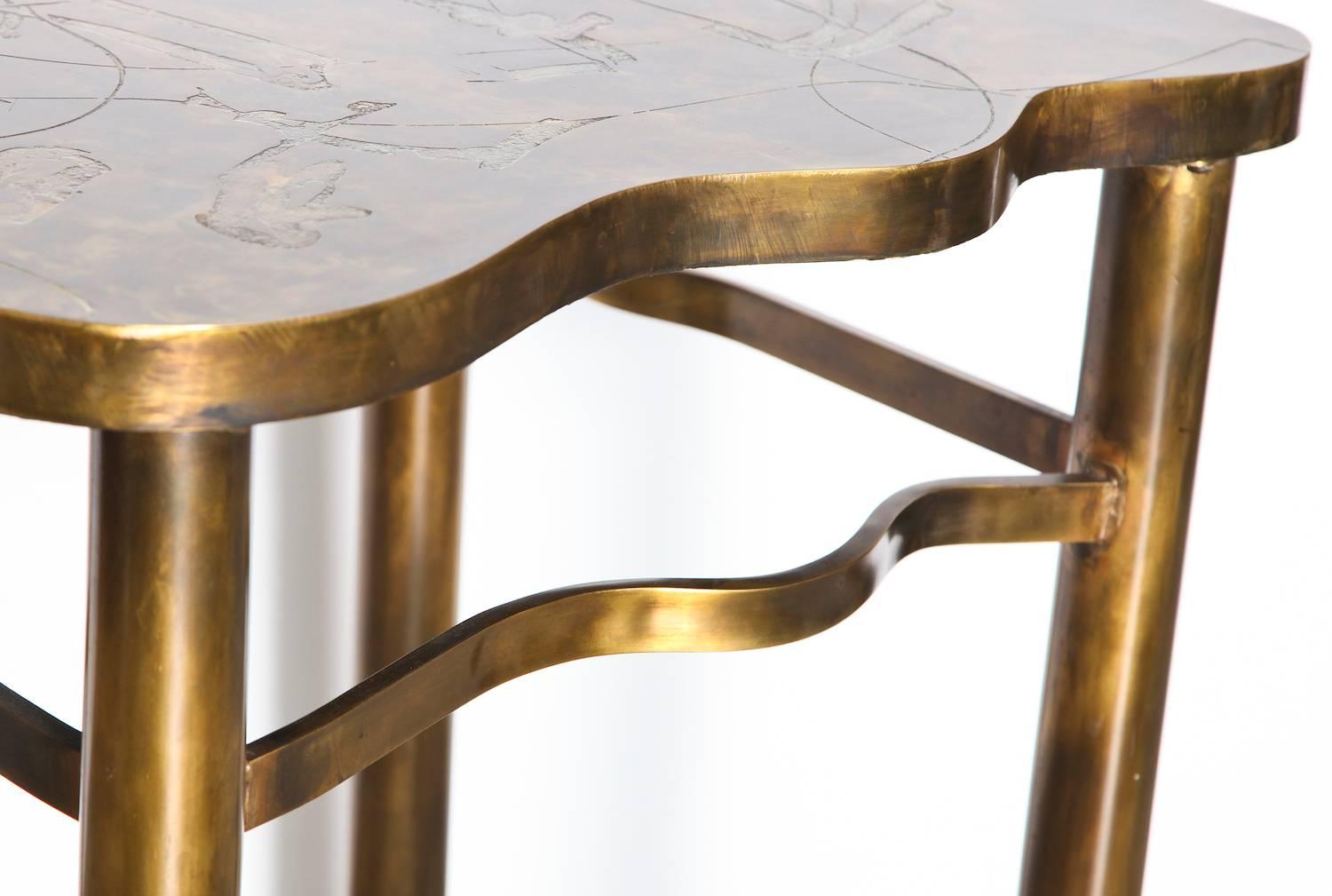 Take the A Train, unique table by Philip & Kelvin LaVerne.  Incredible free-form bronze top with abstract, acid-etched decoration and torched finish. Four cylinder bronze legs with irregular formed stretchers. Etched signature to top edge. A