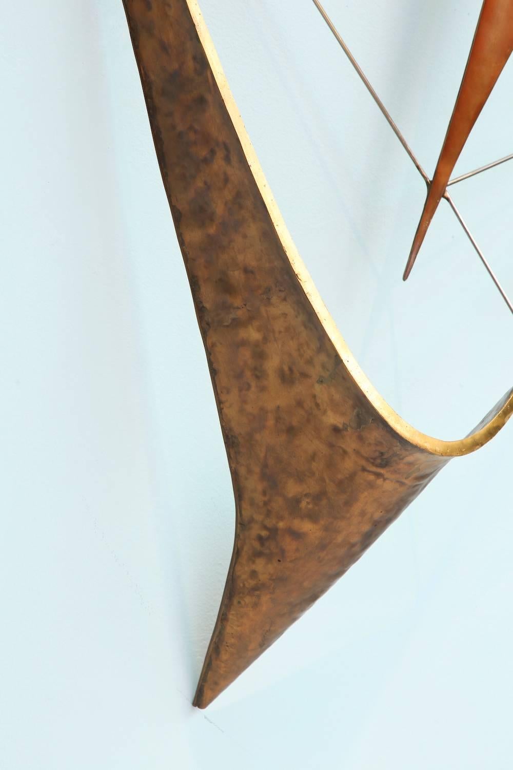 Brass, steel and hammered copper, created as study for a larger wall sculpture that was commissioned by the United Nations. The larger sculpture remains hung in the lobby of the general assembly hall, across from the entrance to the mediation room.