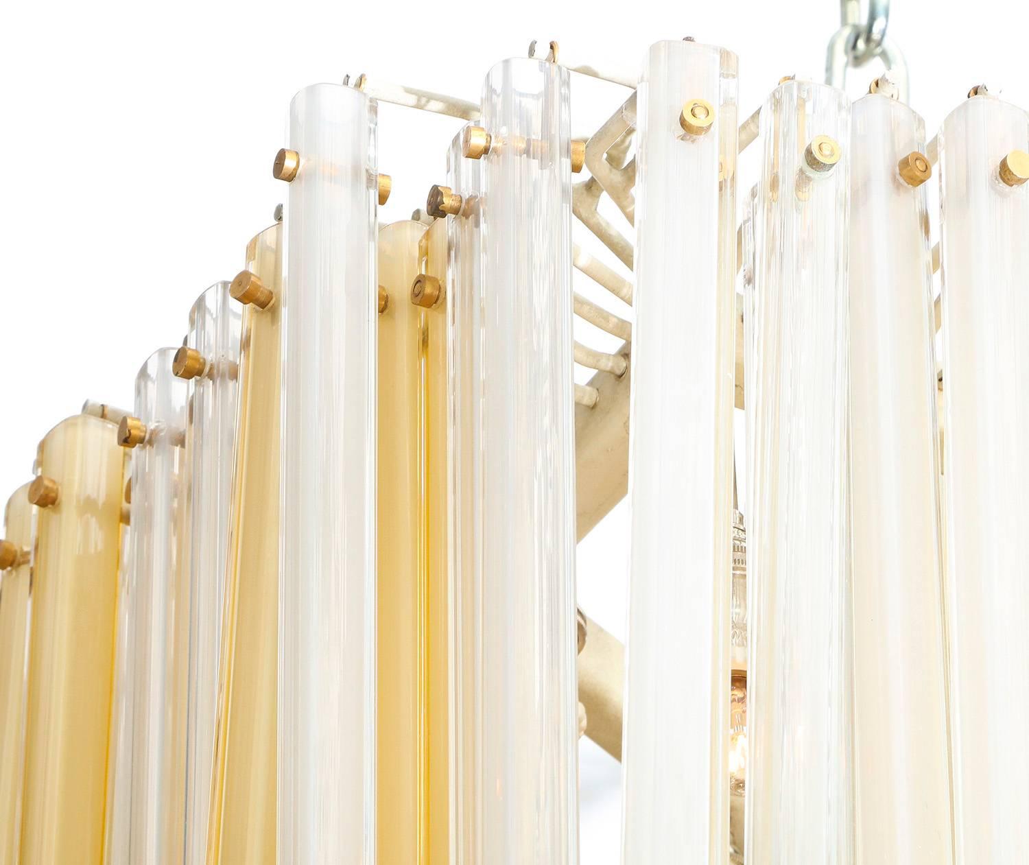 Rare multi-tube hanging light by Venini. Unusual form with hanging glass tubes in satin yellow and clear. 16 candelabra sockets. All new sockets and wiring.