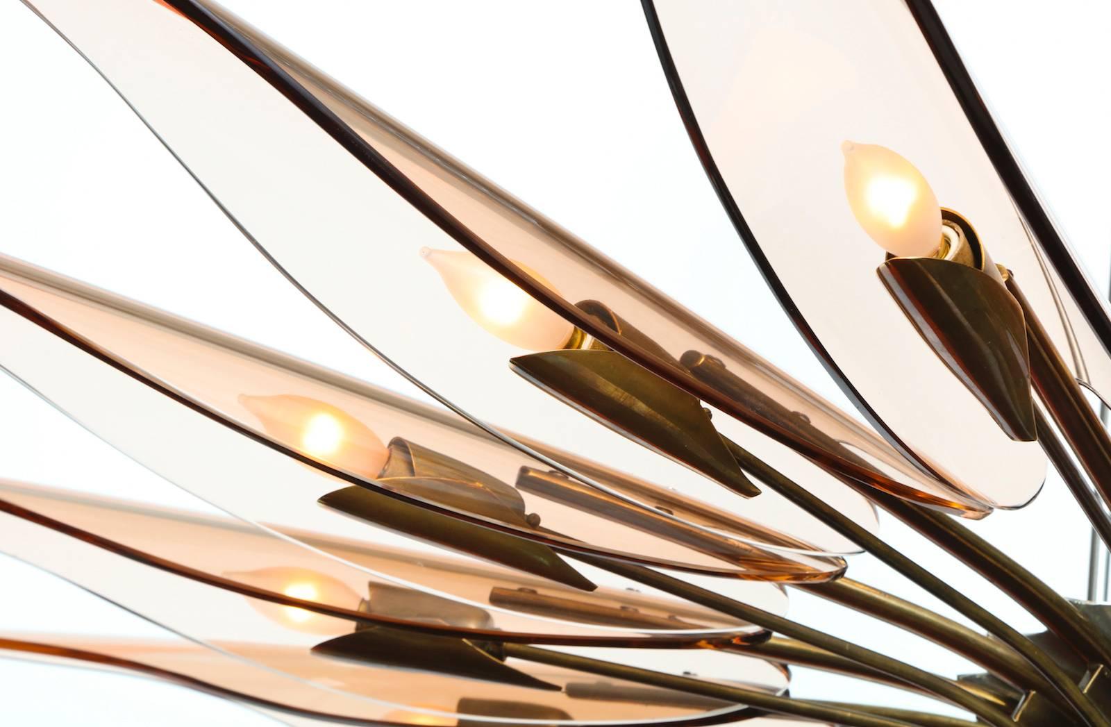 Max Ingrand for Fontana Arte "Dahlia" chandelier. Rare sixteen-light fixture of oxidized brass and nickeled metal. Each arm has an elongated glass petal and one candelabra socket.  Published: Fontana Arte 6, manufacturer's catalog, Pg 11.