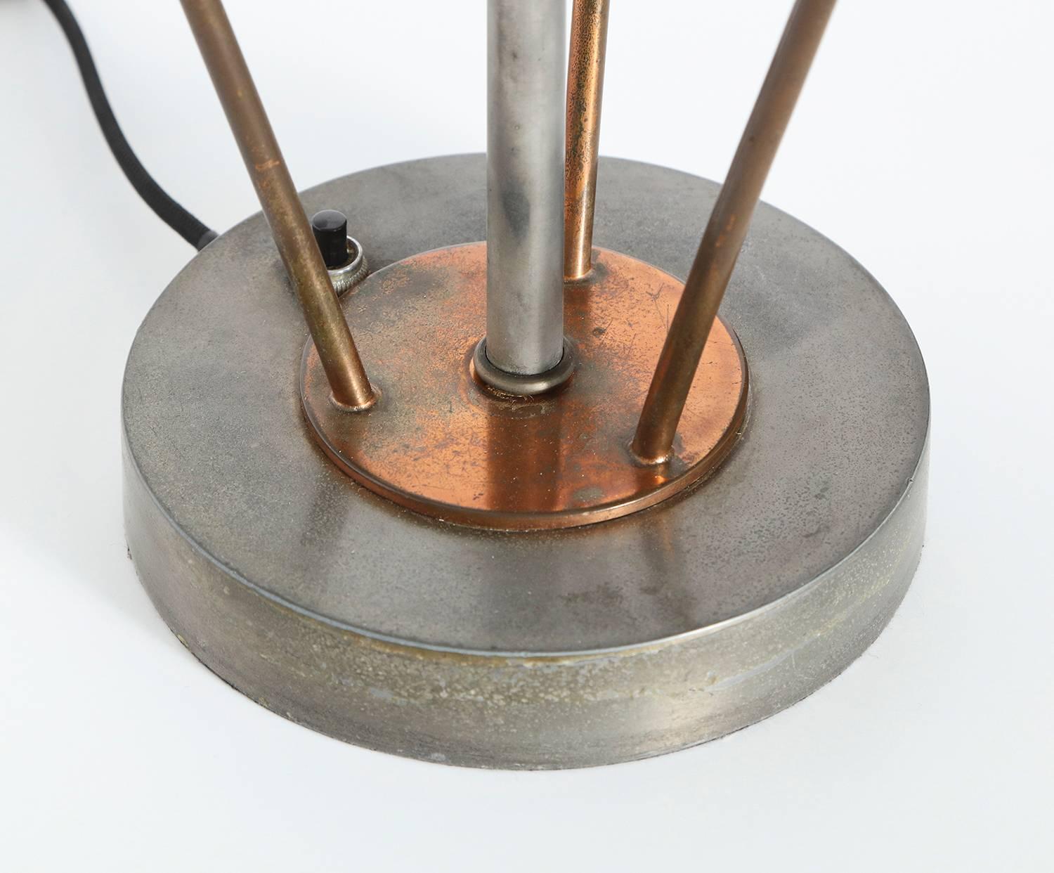Modernist table lamp attributed to Kurt Versen.  Early table lamp with architectural lines and great details. Steel and aluminum with copper-plated, metal supports and frosted, plate glass defuser. Two standard Edison size sockets recently replaced,